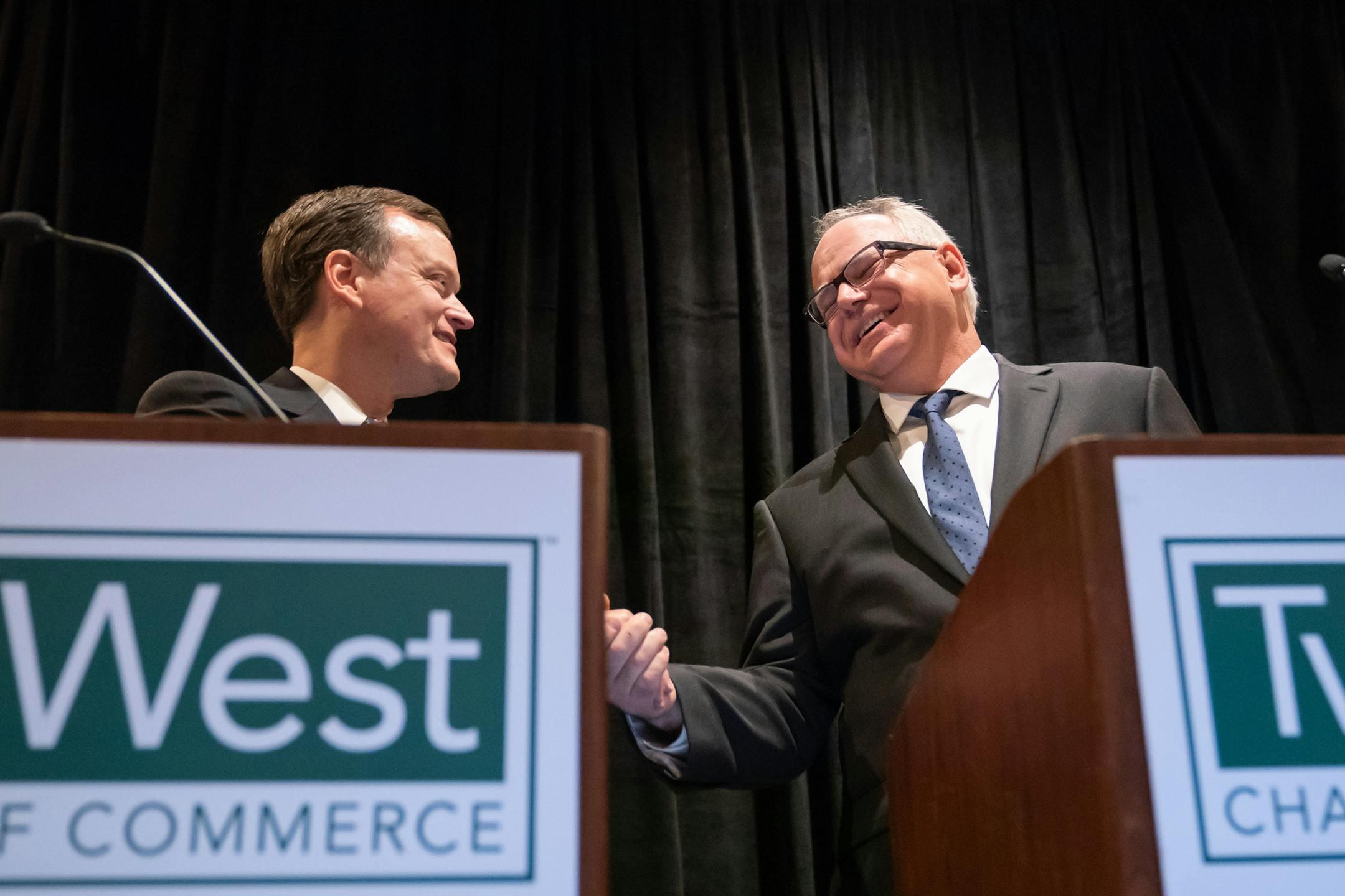 Candidates for governor Jeff Johnson and Tim Walz shook hands at the start of their debate at the Twin West Chamber of Commerce on Wednesday, September 19, 2018 in St. Louis Park.
