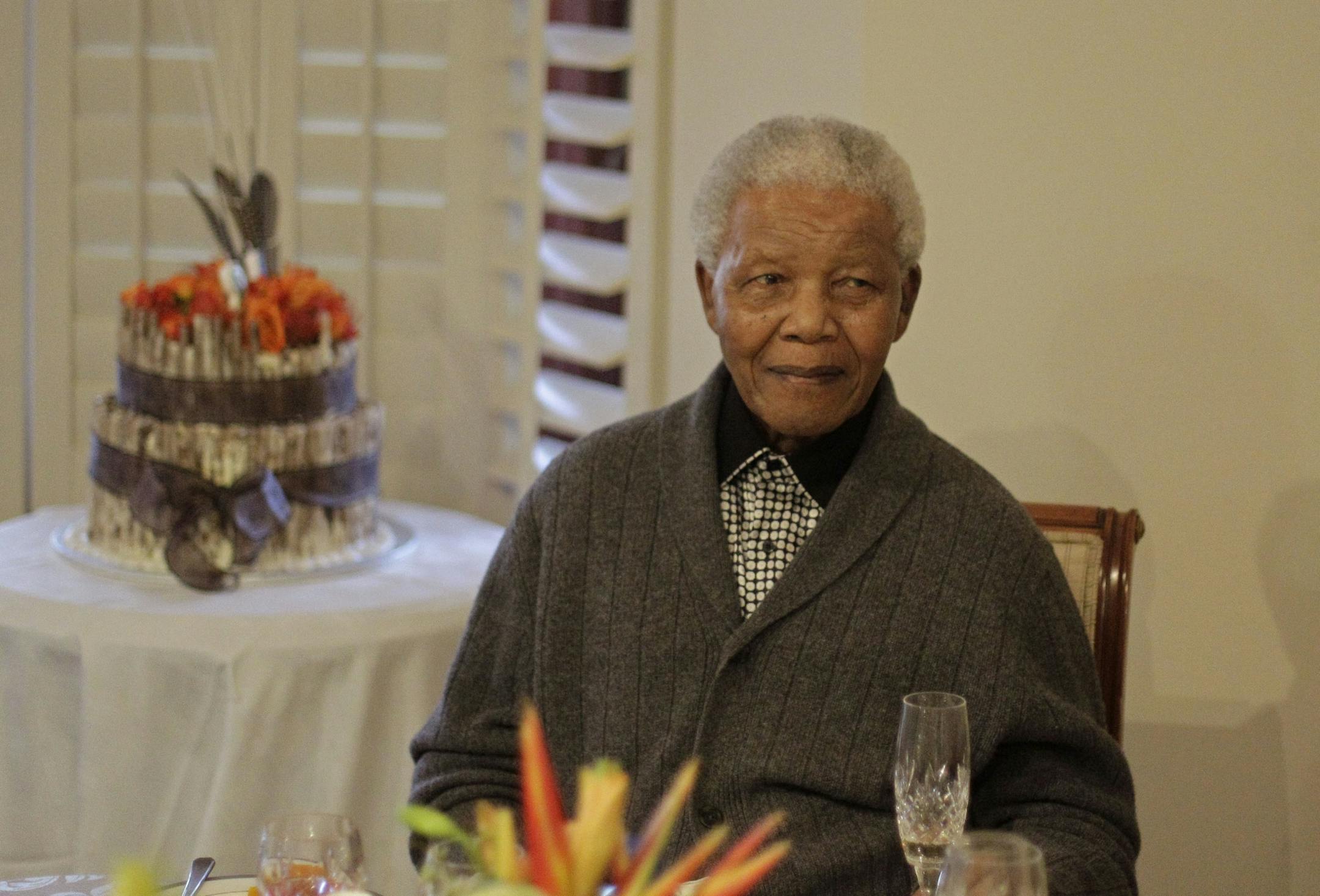 Former South African President Nelson Mandela as he celebrates his birthday with family in Qunu, South Africa, Wednesday, July 18, 2012. Across the country, and even abroad, people are doing good deeds to honor the country's most famous statesman on his 94th birthday Wednesday.