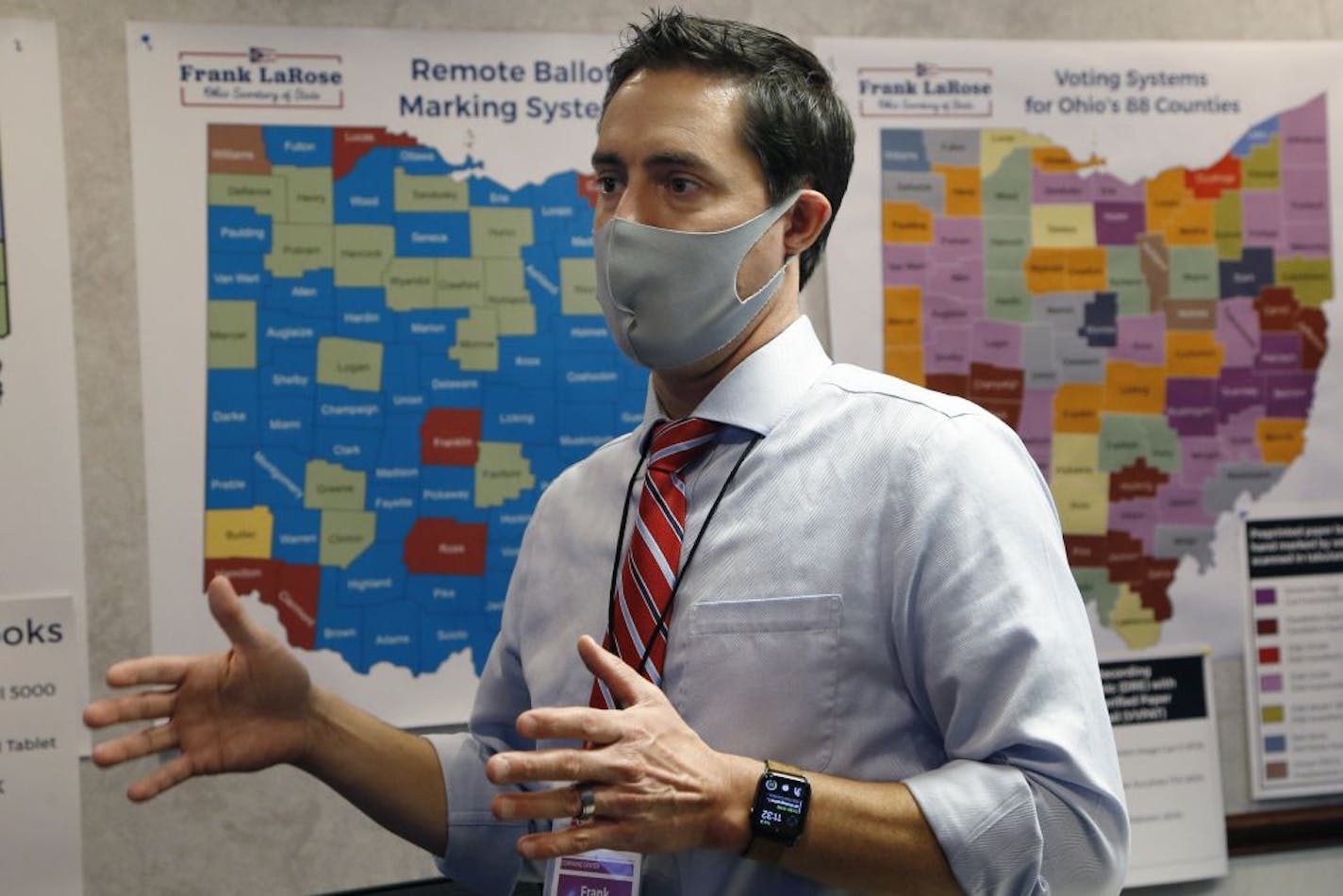 Ohio Secretary of State Frank LaRose interacts with staff members as they follow the election from Ohio's election command center Tuesday, Nov. 3, 2020, in Columbus, Ohio.