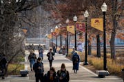 Students cross the Twin Cities campus of the University of Minnesota in 2021.