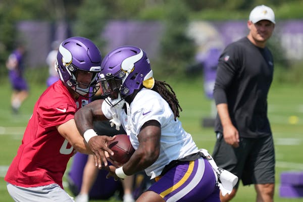 Vikings quarterback Kirk Cousins and running back Dalvin Cook practice under the watchful eye of new head coach Kevin O’Connell. 