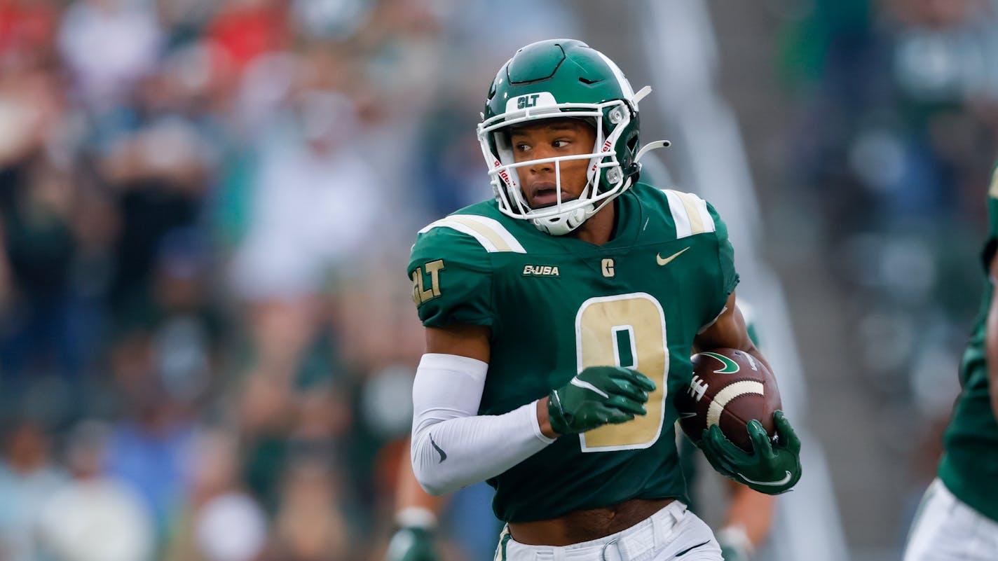 Charlotte wide receiver Elijah Spencer runs with the ball against Maryland during an NCAA college football game in Charlotte, N.C., Saturday, Sept. 10, 2022. (AP Photo/Nell Redmond)