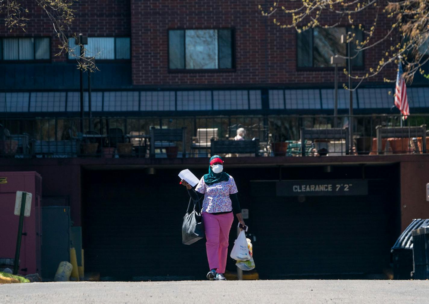 An employee leaves the grounds during a shift change at St. Therese of New Hope, a nursing home where 55 people have died of the coronavirus, the most at any long-term care facility in Minnesota.