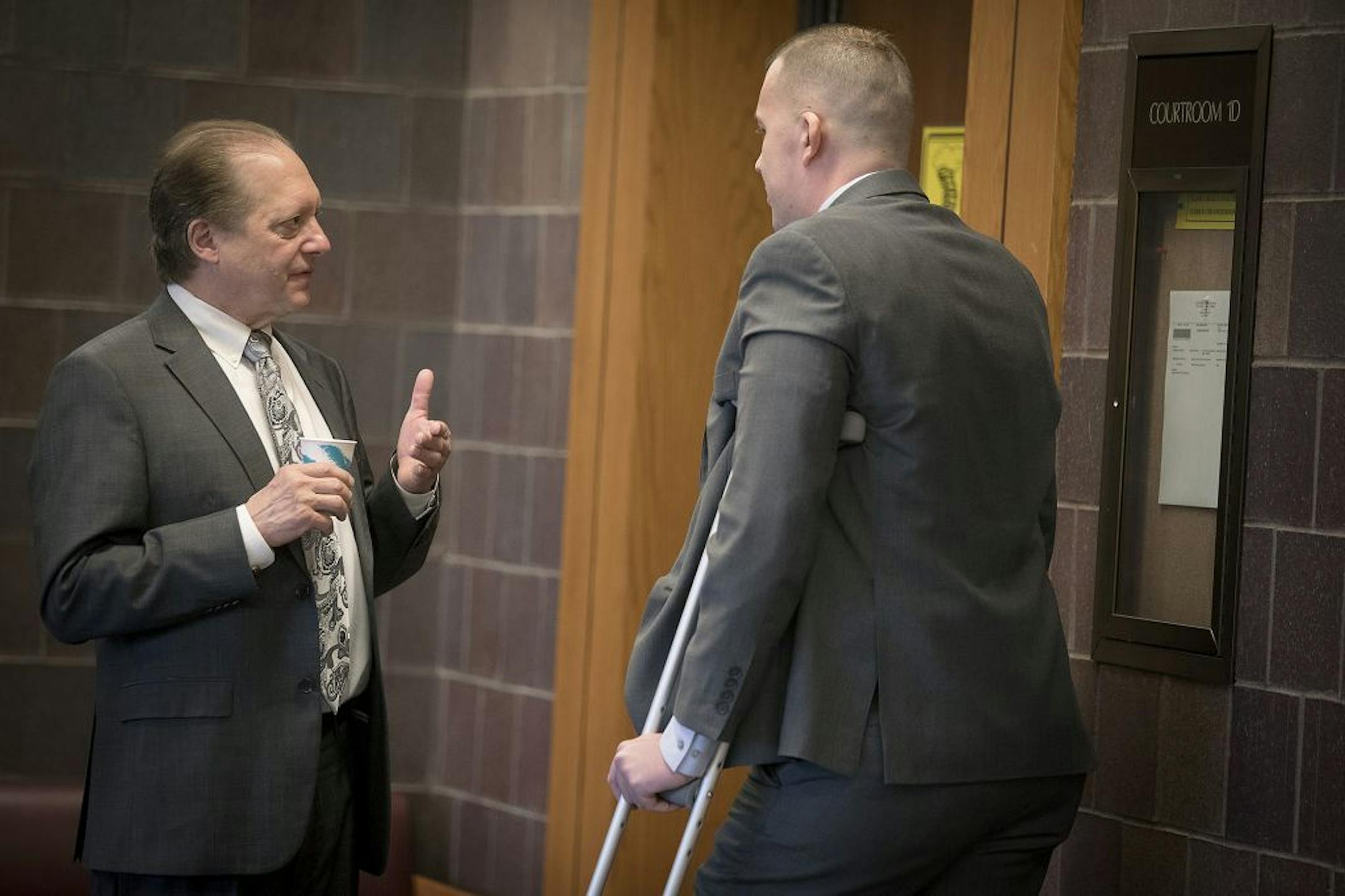 Criminal defense lawyer Fred Bruno consulted with his client Brian R. Johnson outside a courtroom at the Dakota County District Court, Wednesday, April 19, 2017 in Hastings, MN.