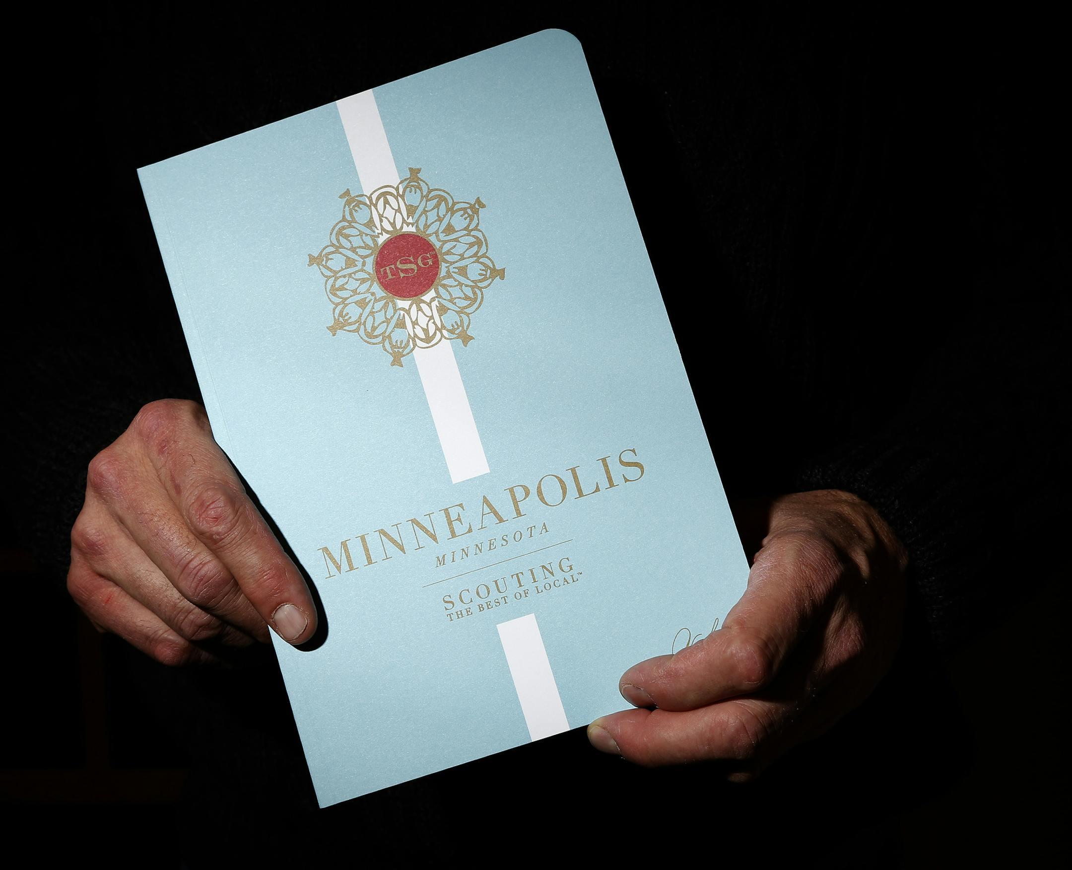 Bill Damberg, held a Scout Guide during a launch party for the magazine at his store Brightwater in Edina. ] CARLOS GONZALEZ cgonzalez@startribune.com - November 12, 2014, Edina, Minn., Bill Damberg, owner of Brightwater, is holding a launch party for the Scout Guide in his retail store featured in the mag.