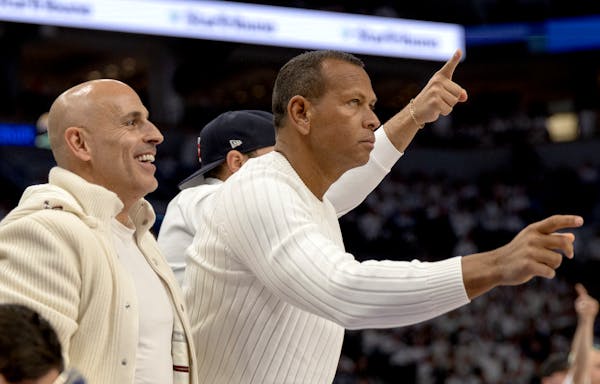 Minority team owners Marc Lore and Alex Rodriguez attend a Timberwolves game in March at Target Center in Minneapolis.
