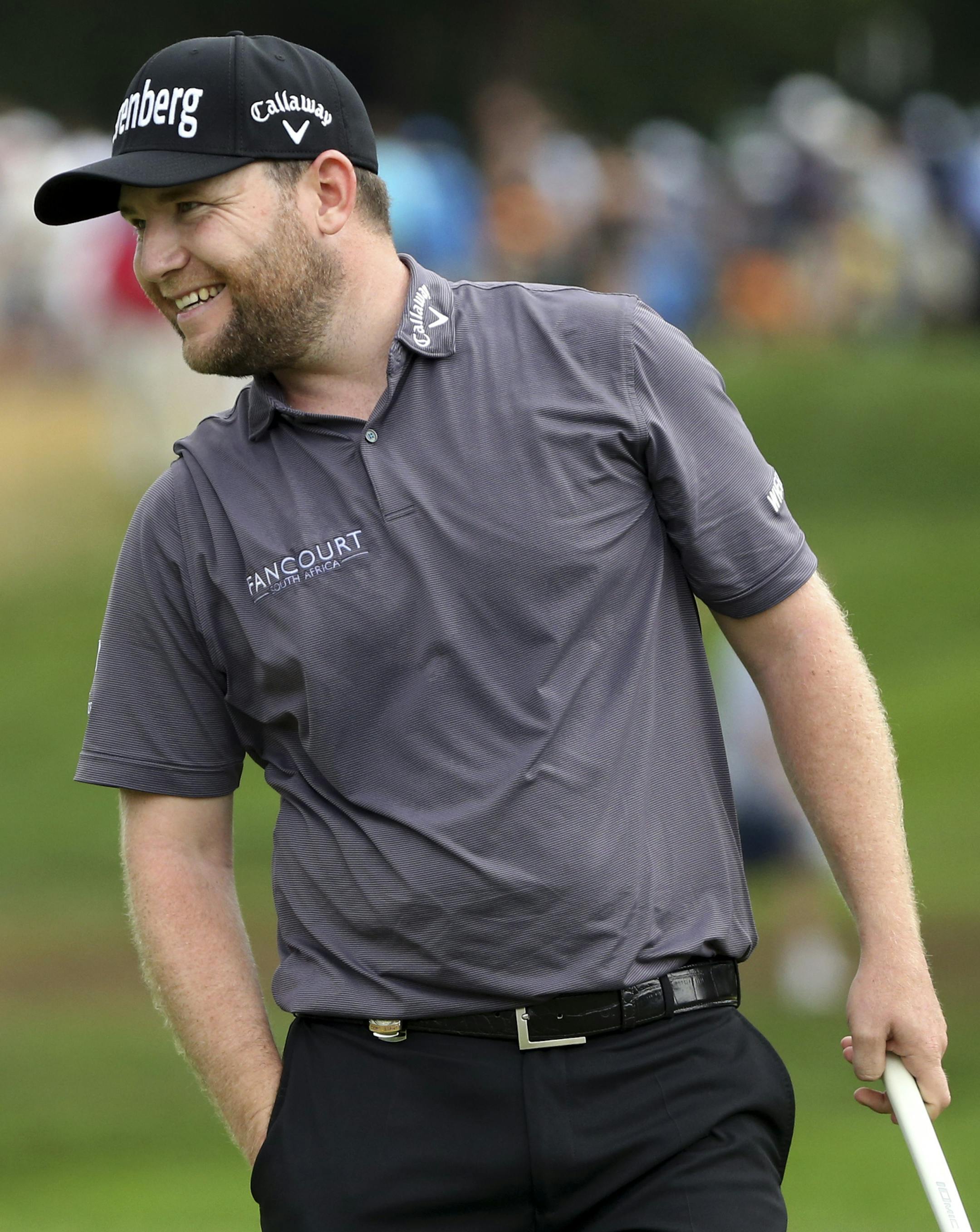 Branden Grace smiles after putting on the 16th hole during the final round of the PGA Championship golf tournament at Baltusrol Golf Club in Springfield, N.J., Sunday, July 31, 2016. (AP Photo/Seth Wenig)