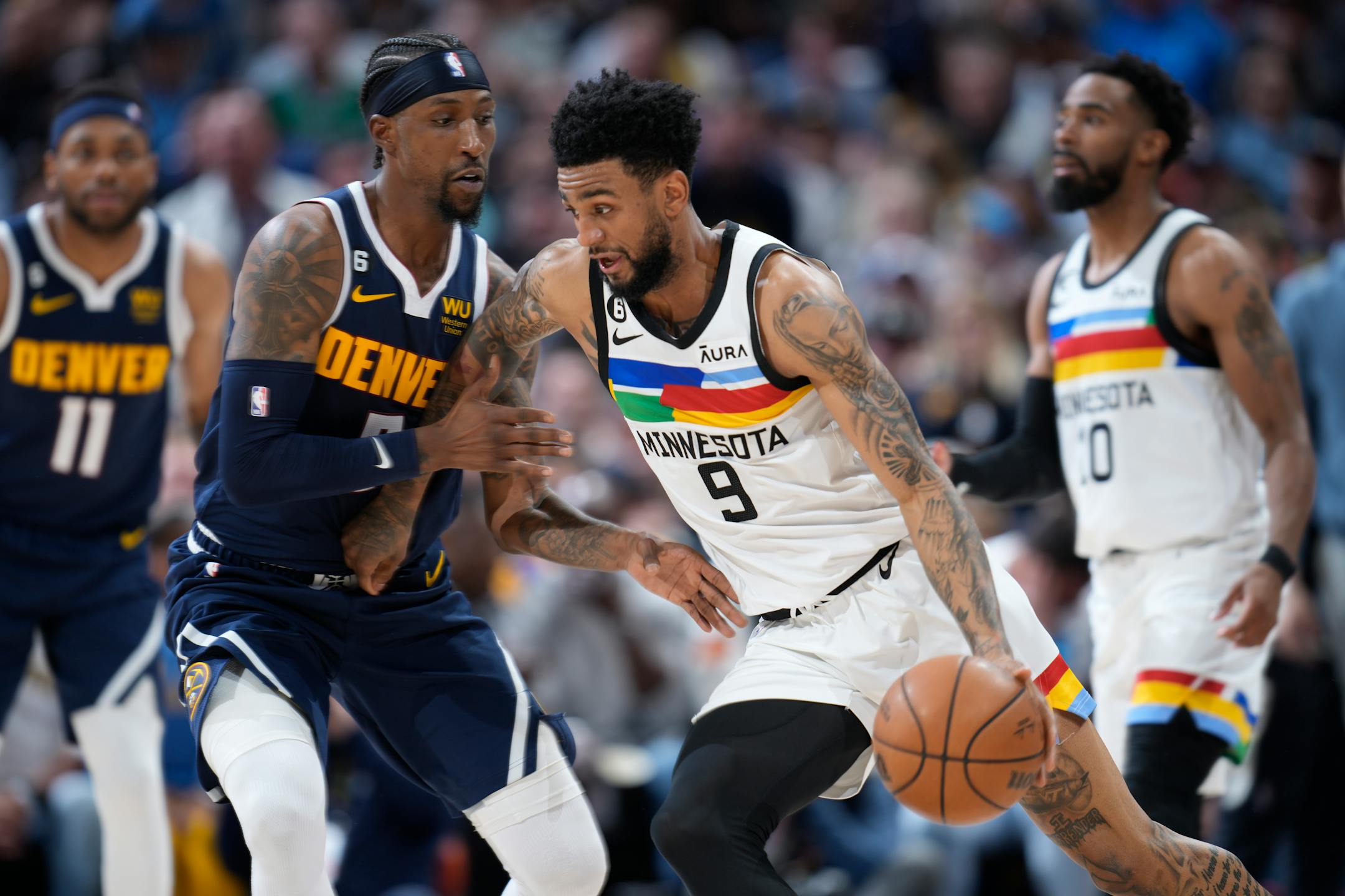 Minnesota Timberwolves guard Nickeil Alexander-Walker drives against Denver Nuggets guard Kentavious Caldwell-Pope during the second half.