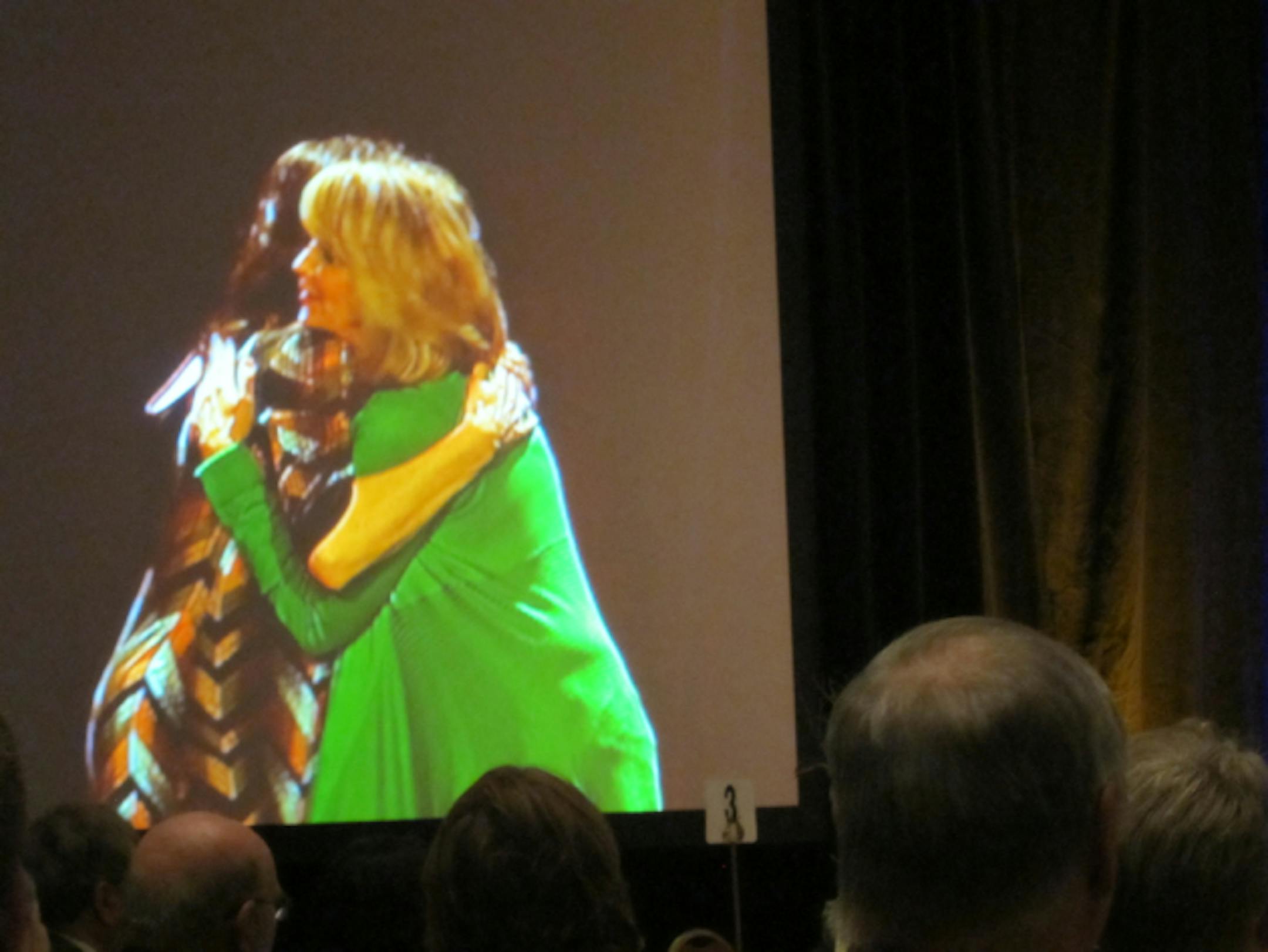 Lorna Landvik and Louise Erdrich embrace after Erdrich receives the Minnesota Book Award for fiction.