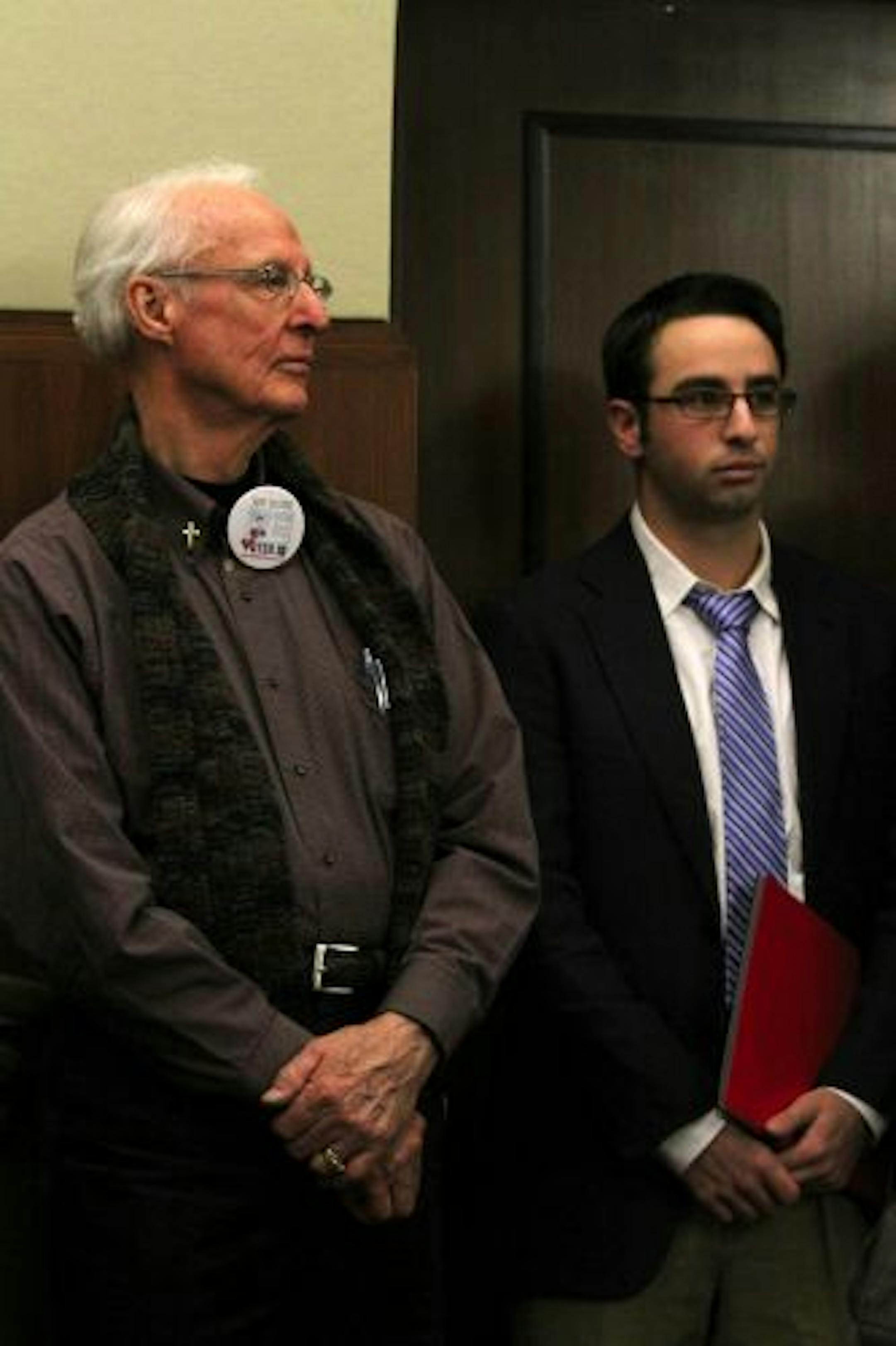 Lyle Clemenson, left, and Matt Butler from Macalester College MPIRG were on opposing sides of the voter ID issue as testimony on an election overhaul bill was heard Thursday in St. Paul.