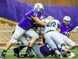 David Simmet (75) applies a tackle during a football game against Bethel University October 24, 2015 at O'Shaughnessy Stadium. The Tommies beat the Ro
