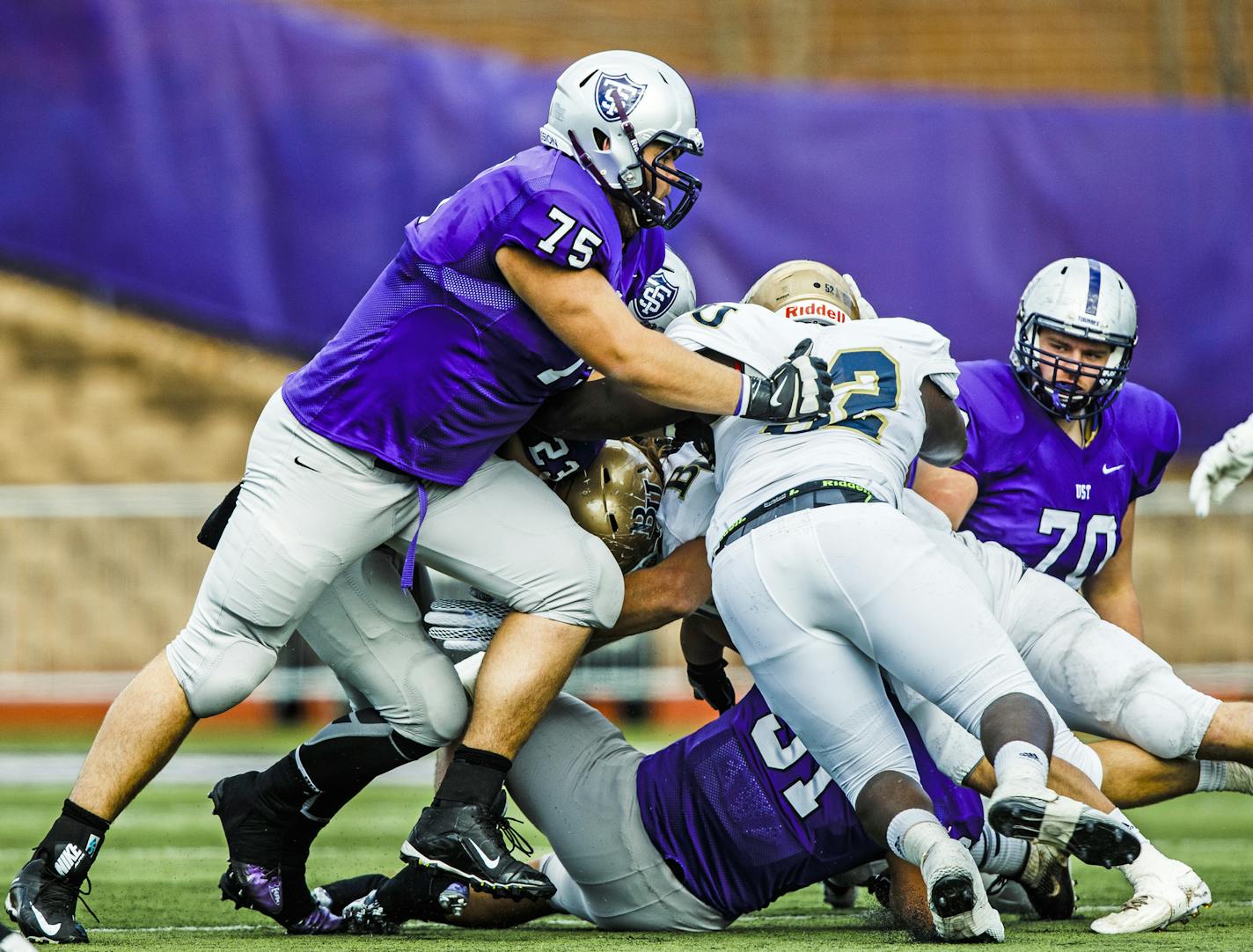 David Simmet (75) applies a tackle during a football game against Bethel University October 24, 2015 at O'Shaughnessy Stadium. The Tommies beat the Royals 45-14.