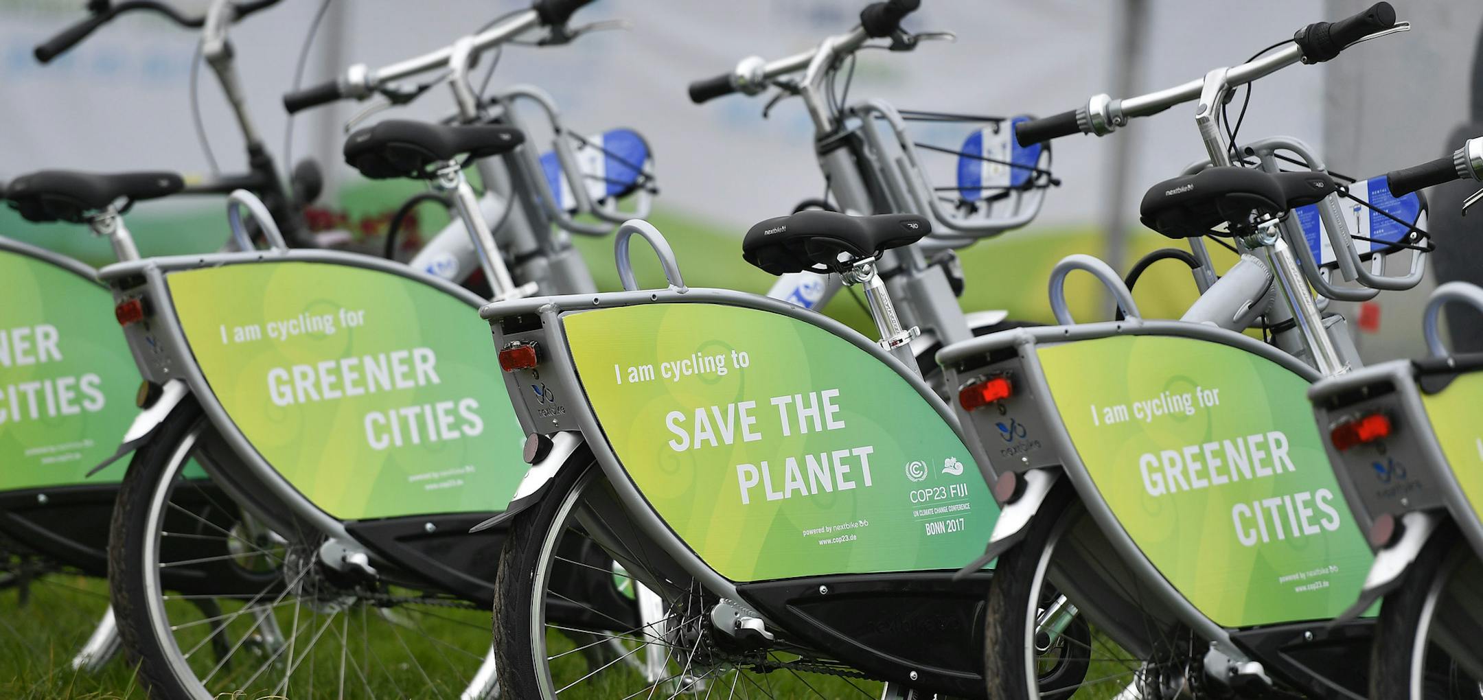 Bicycles reading "save the planet" wait for customers at the COP 23 Fiji UN Climate Change Conference in Bonn, Germany, Monday, Nov. 6, 2017. (AP Photo/Martin Meissner)