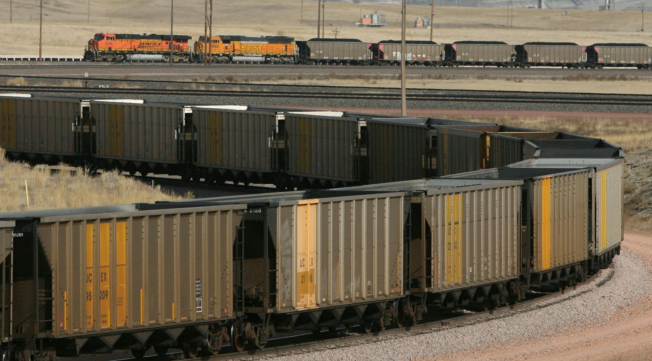 An empty train in the foreground awaits loading while a full coal train in the background starts to make its journey east from the Black Thunder coal mine near Wright, Wyo. (J.B. Forbes/St. Louis Post-Dispatch/TNS) ORG XMIT: 1160191