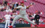 Phillies starting pitcher Ranger Suárez throws in the first inning against the Reds on Monday in Cincinnati.