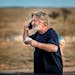 Alec Baldwin speaks on the phone in the parking lot outside the Santa Fe County Sheriff’s Office in Santa Fe, N.M., after he was questioned about a 