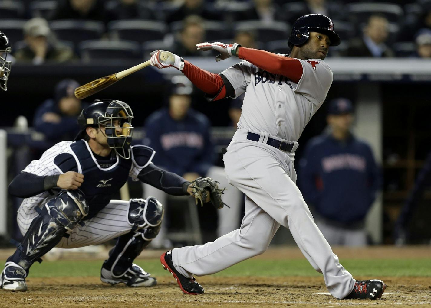 Boston Red Sox's Jackie Bradley, right, hits a seventh-inning RBI double against the New York Yankees in a baseball game at Yankee Stadium in New York, Thursday, April 4, 2013. (AP Photo/Kathy Willens) ORG XMIT: MIN2013040616305747