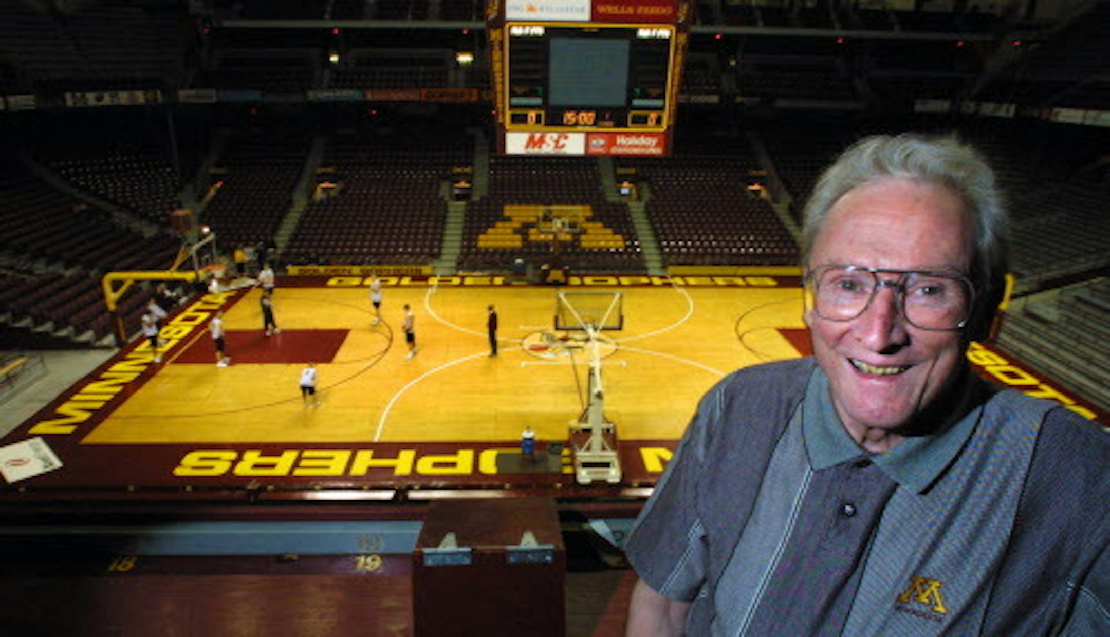 GENERAL INFORMATION: MINNEAPOLIS, MN - 2/27/2001 - TUE - Profile shot of Ray Christensen, who will retire after 50 years as the voice of the Gophers.
IN THIS PHOTO: In his broadcasting perch in an empty Williams Arena. ORG XMIT: MIN2017020613245443