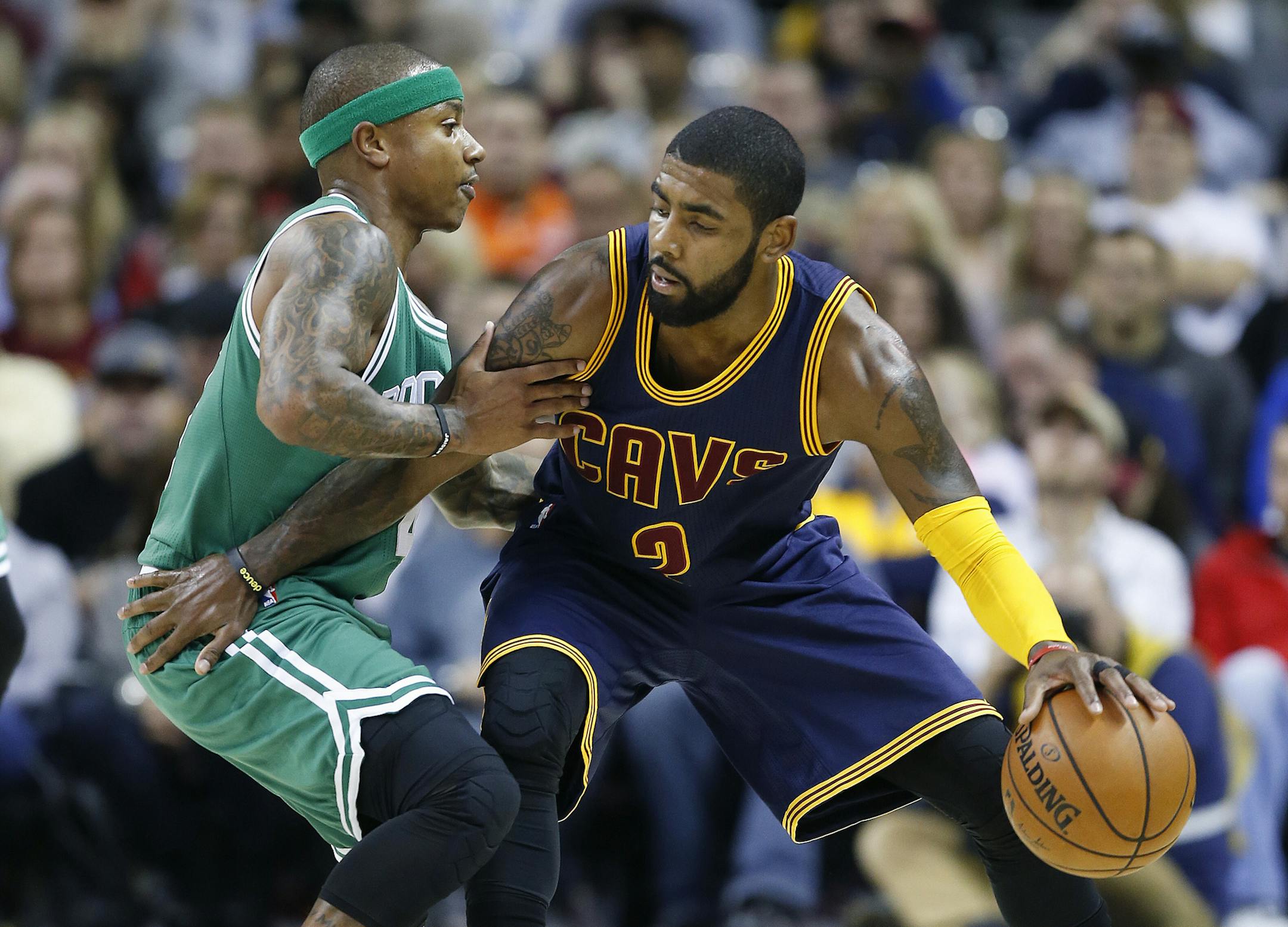 FILE - In this Nov. 3, 2016, file photo, Cleveland Cavaliers' Kyrie Irving, right, looks to drive against Boston Celtics' Isaiah Thomas during the first half of an NBA basketball game in Cleveland. Irving, who asked Cavaliers owner Dan Gilbert to trade him earlier this summer, could be on his way to Boston as the Cavaliers are in serious negotiations with the Celtics about swapping him for point guard Thomas. Since Irving made his stunning request, the defending Eastern Conference champions have