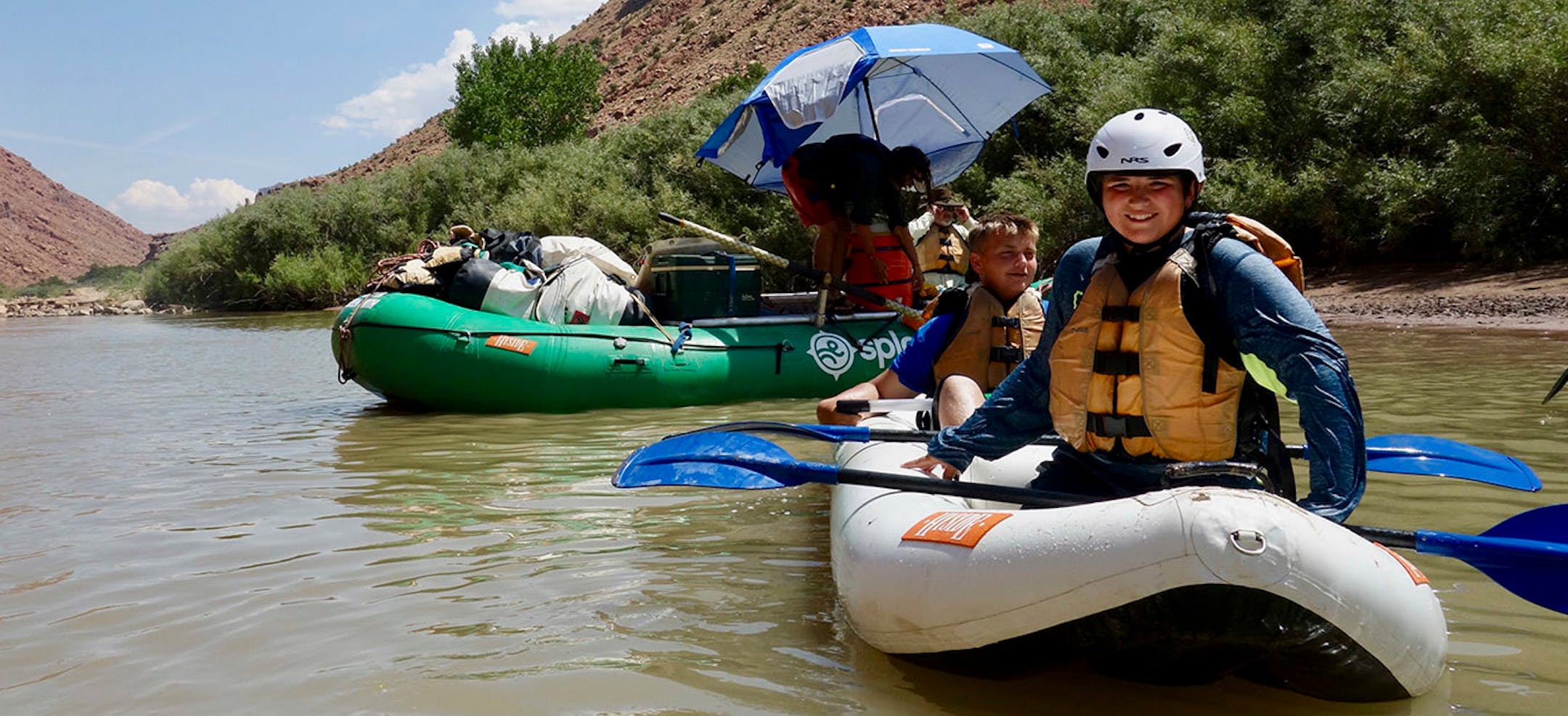 Chayse Buchta (left) and Justin Buchta (right) after navigating the Duckie inflatable kayak through a set of rapids.