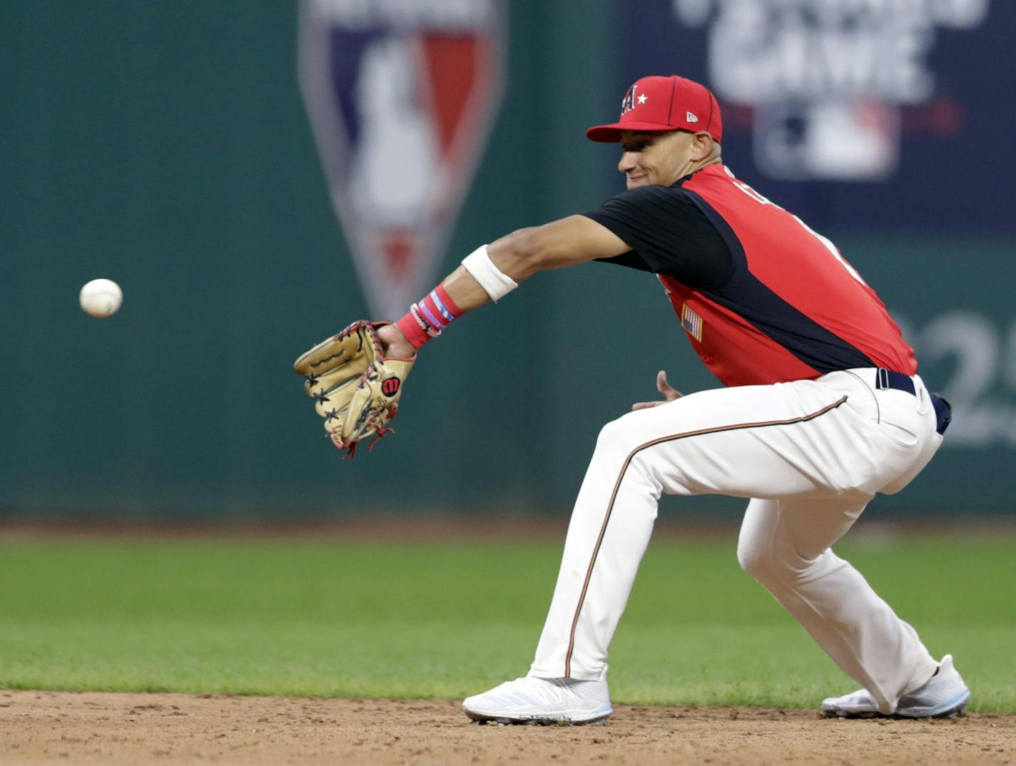 Royce Lewis, of the Minnesota Twins, makes a play on a ball hit by Cristian Pache, of the Atlanta Braves, during the seventh inning of the MLB All-Star Futures baseball game, Sunday, July 7, 2019, in Cleveland. The MLB baseball All-Star Game is to be played Tuesday. (AP Photo/Tony Dejak)