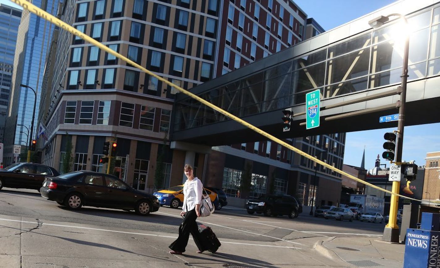 A pedestrian walked by the crime tape where a woman was stabbed by another in the transit station in Ramp A in June.