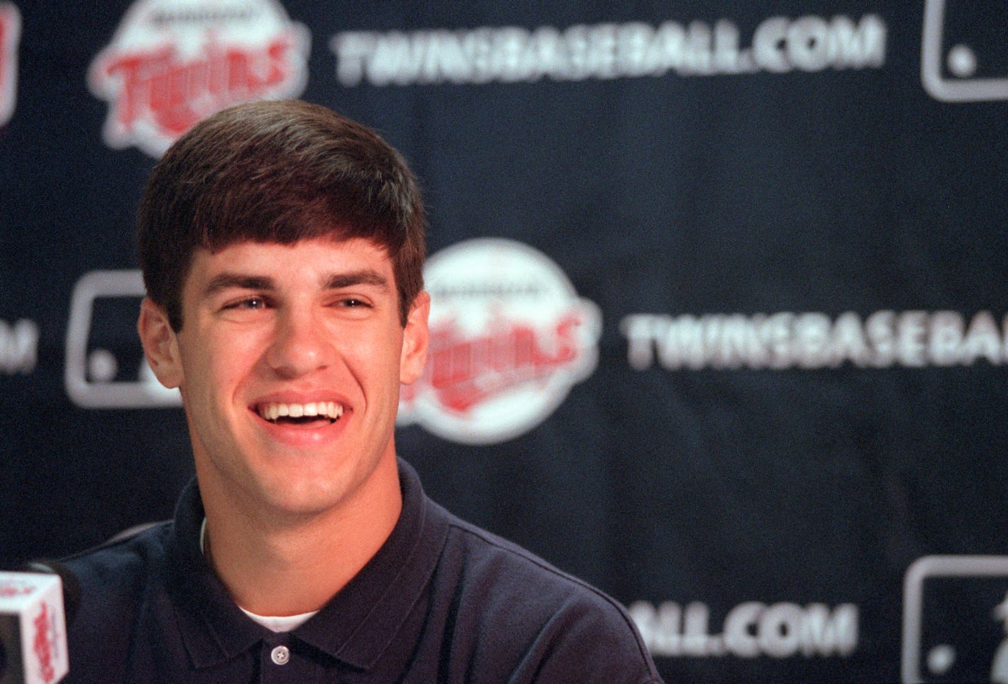 GENERAL INFORMATION: Twins press conference to announce the signing of No. 1 overall draft pick Joe Mauer, a Cretin-Derham Hall grad who will head to the club's Elizabethtown Rookie League IN THIS PHOTO: Joe Mauer, a Cretin-Derham Hall grad smiles at a Twins press conference at the Metrodome in Minneapolis on Wednesday after signing a contract with the Twins. Mauer, will head to the club's Elizabethtown Rookie League in Tennessee. ORG XMIT: MIN2013041718222050