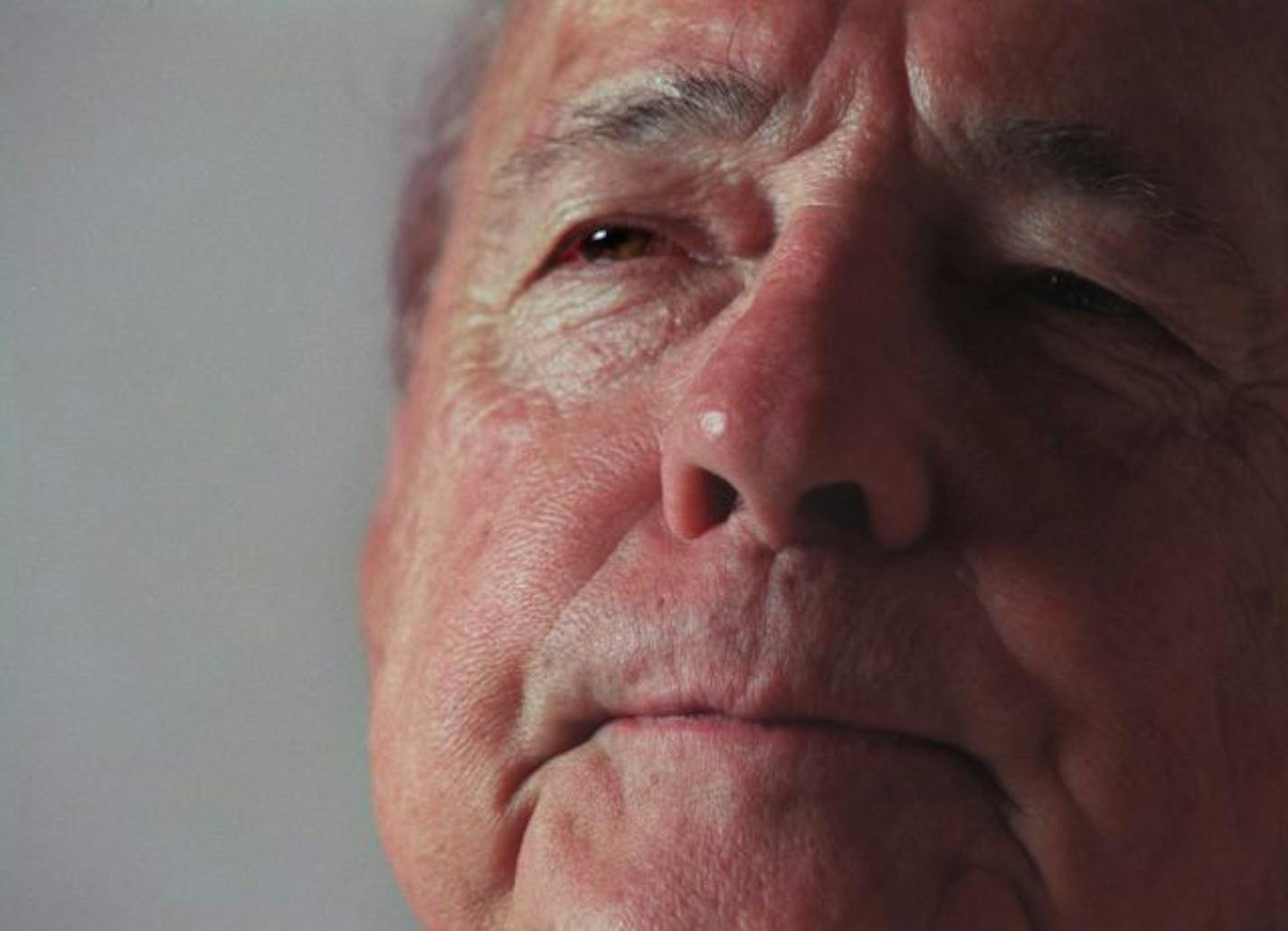 Wrestling legend Verne Gagne watches a WWF program on television in 2006.