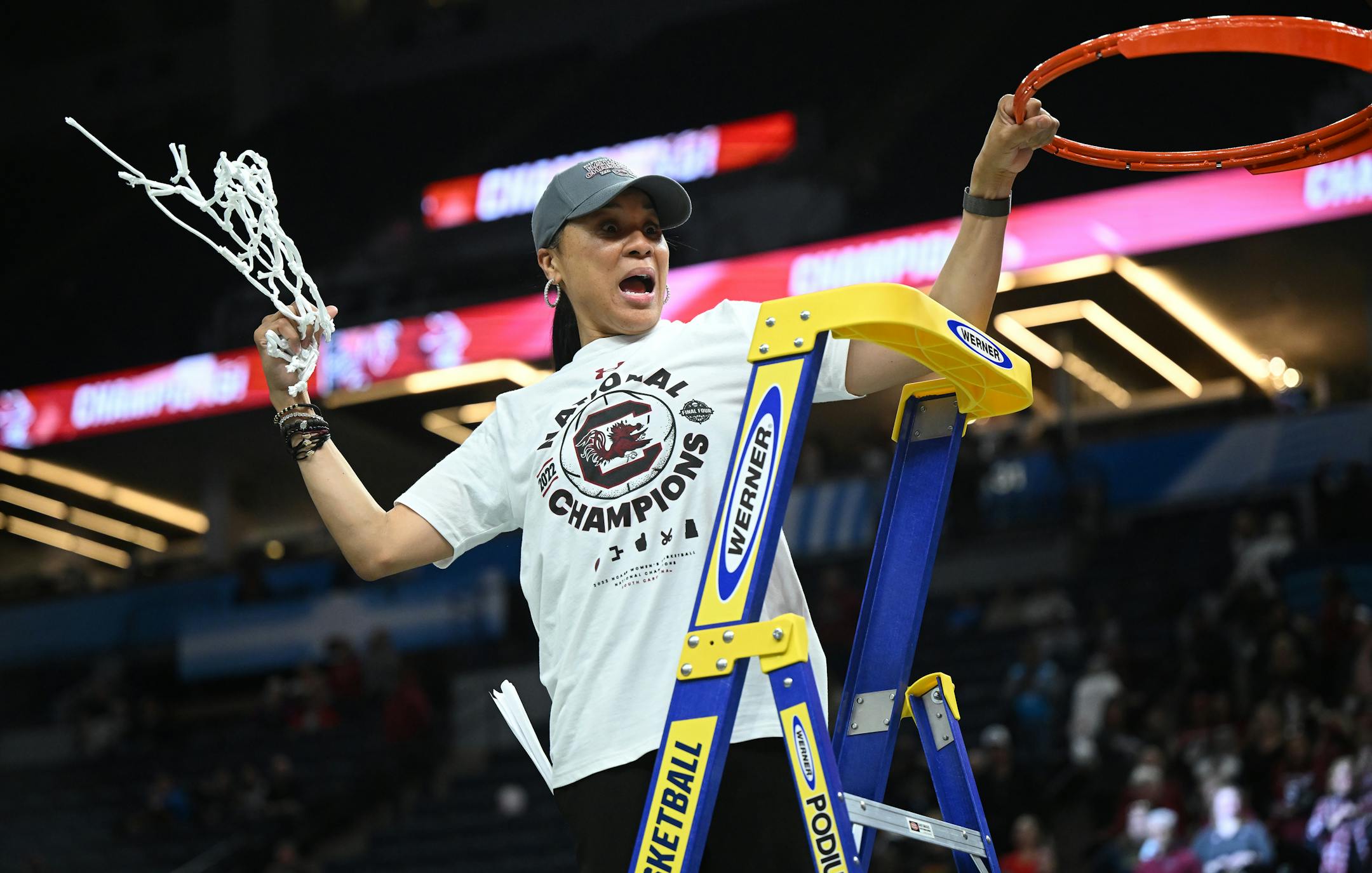 South Carolina head coach Dawn Staley reacts to the crowd after cutting down the net following South Carolina's 64-49 win over UConn.