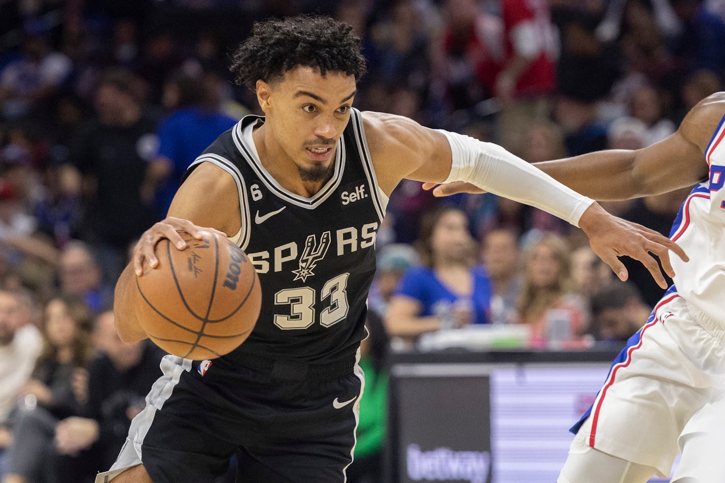 San Antonio Spurs guard Tre Jones (33) in action during an NBA basketball game, Saturday against the Philadelphia 76ers, Oct. 22, 2022, in Philadelphia. (AP Photo/Laurence Kesterson)