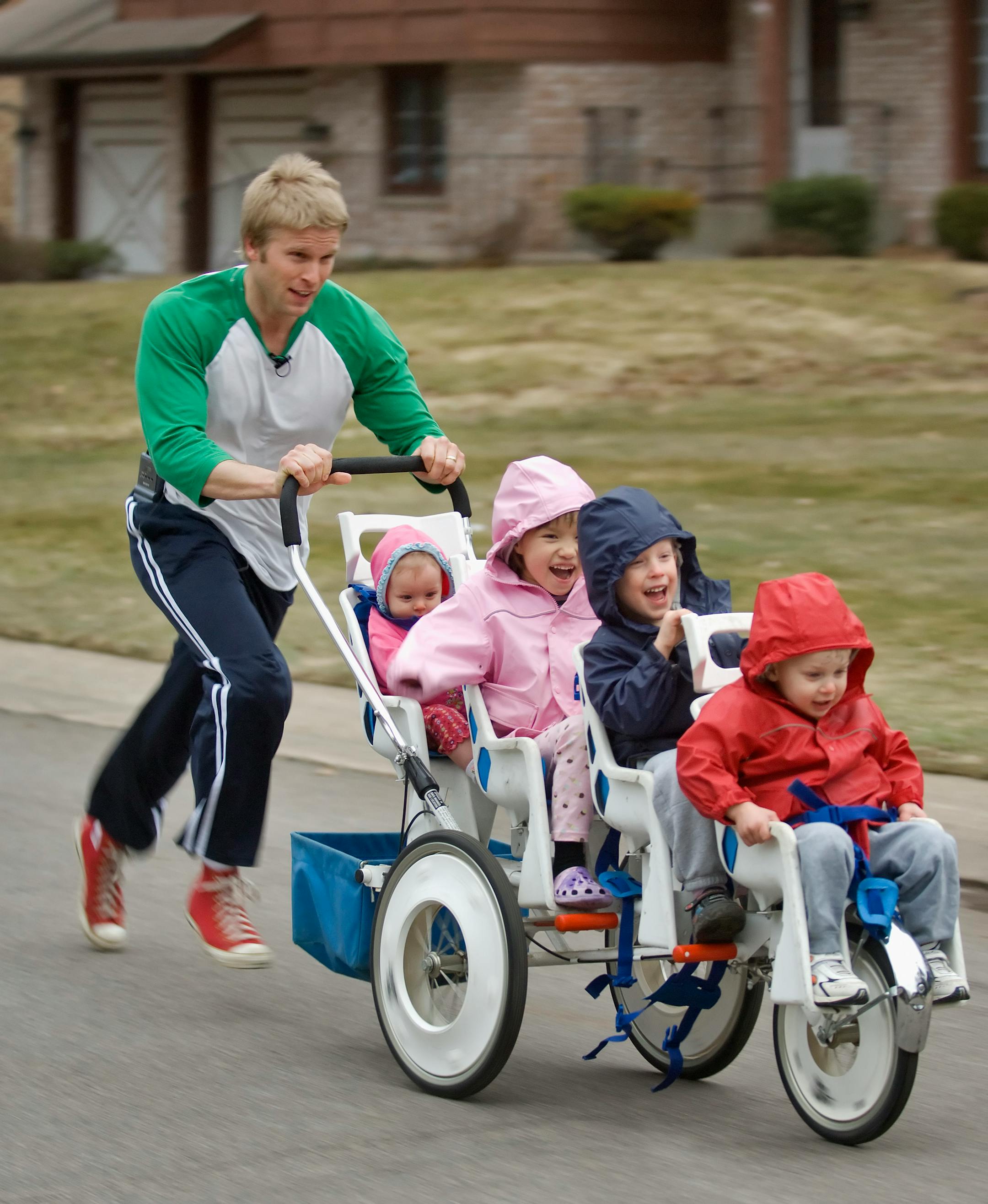 Sheff Otis demonstrates how he uses his kids during his workout. A two mile run is a the usual jaunt for dad, just a short ride for the kids.
