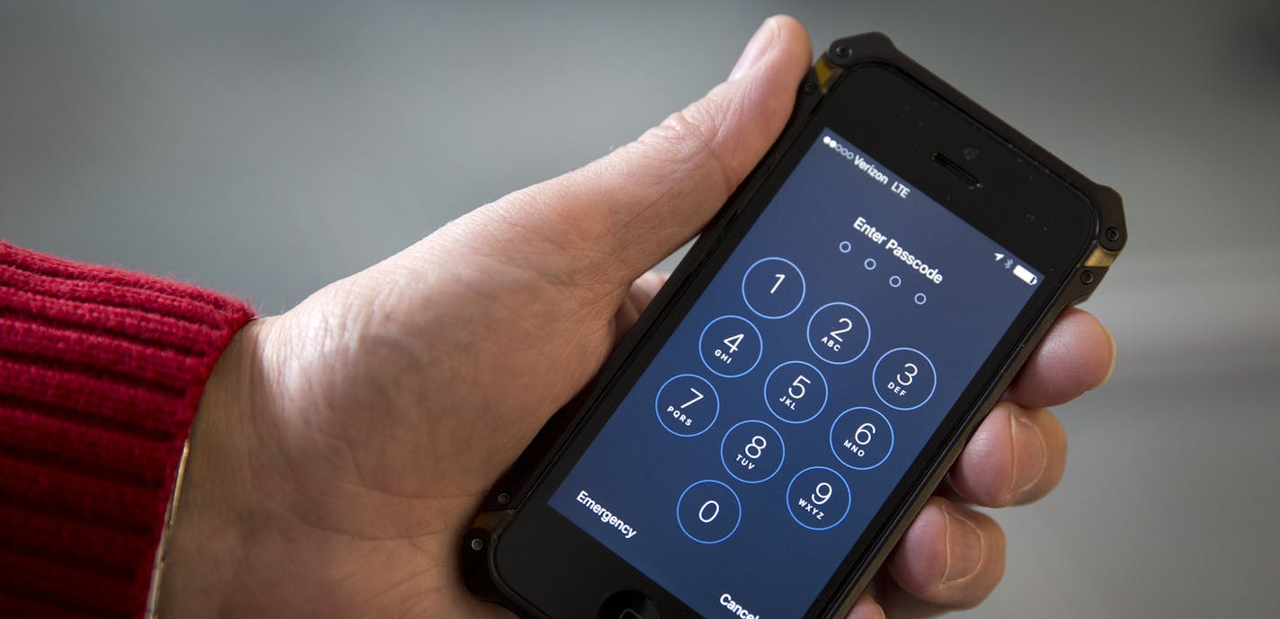 An iPhone is seen in Washington, Wednesday, Feb. 17, 2016. A U.S. magistrate judge has ordered Apple to help the FBI break into a work-issued iPhone used by one of the two gunmen in the mass shooting in San Bernardino, California, a significant legal victory for the Justice Department in an ongoing policy battle between digital privacy and national security. Apple CEO Tim Cook immediately objected, setting the stage for a high-stakes legal fight between Silicon Valley and the federal government.