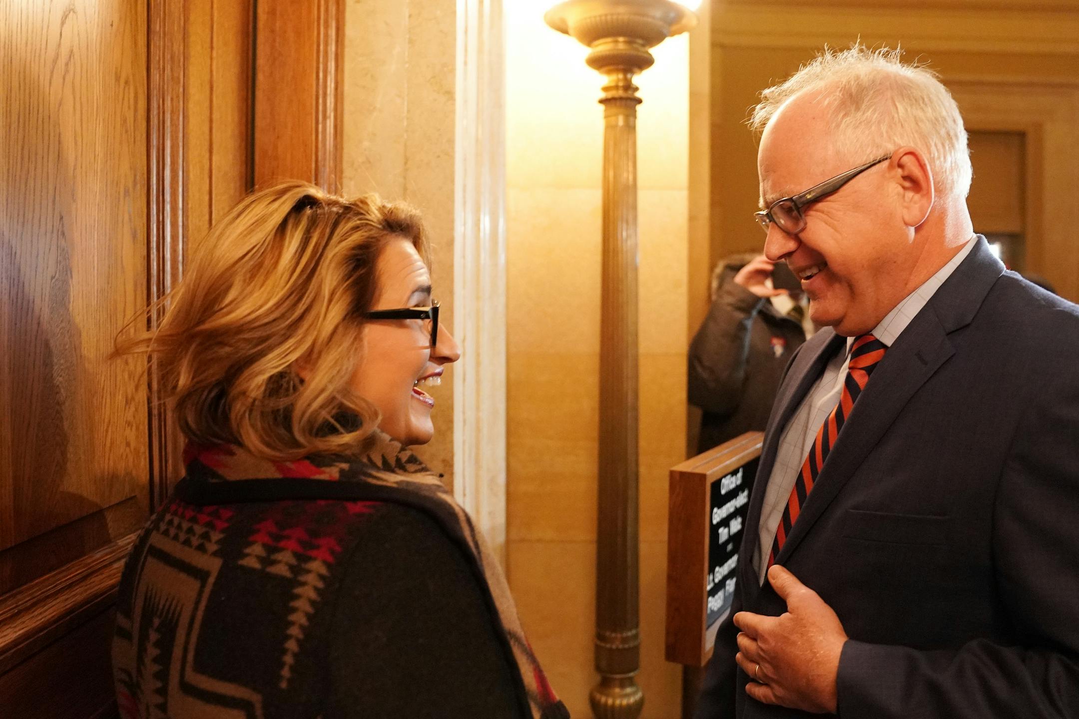 Lt. Gov.-elect Peggy Flanagan and Gov.-elect Tim Walz smiled at each other before opening the door to their transition offices in the State Capitol Thursday morning.