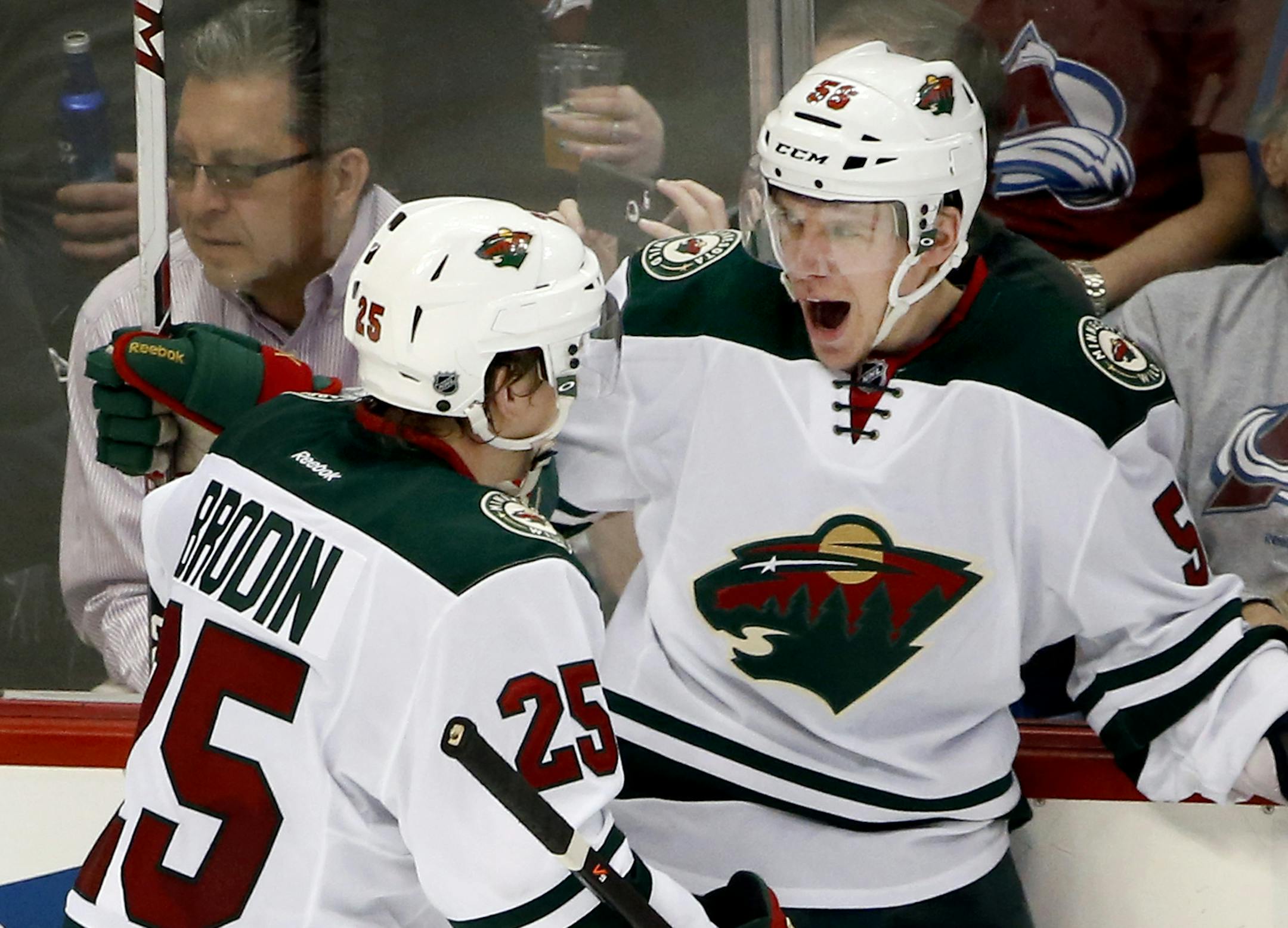 Jonas Brodin (25) and Erik Haula (56) celebrated a goal by Haula in the second period. ] CARLOS GONZALEZ cgonzalez@startribune.com - April 17, 2014, Denver, Colorado, Pepsi Center, NHL, Minnesota Wild vs. Colorado Avalanche, Stanley Cup Playoffs round 1, Game 1