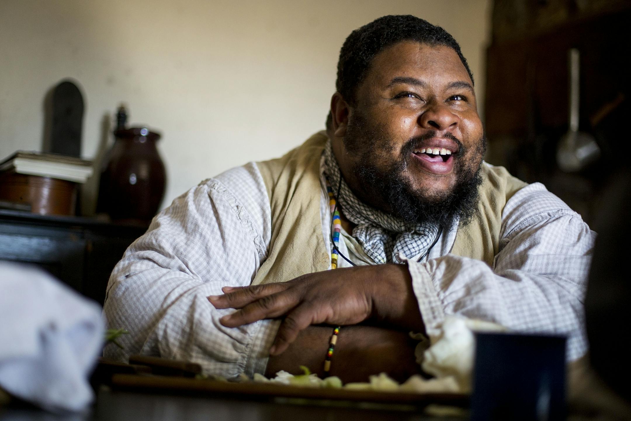 Michael Twitty laughs as he tells stories about his travels and experiences to the crowd.