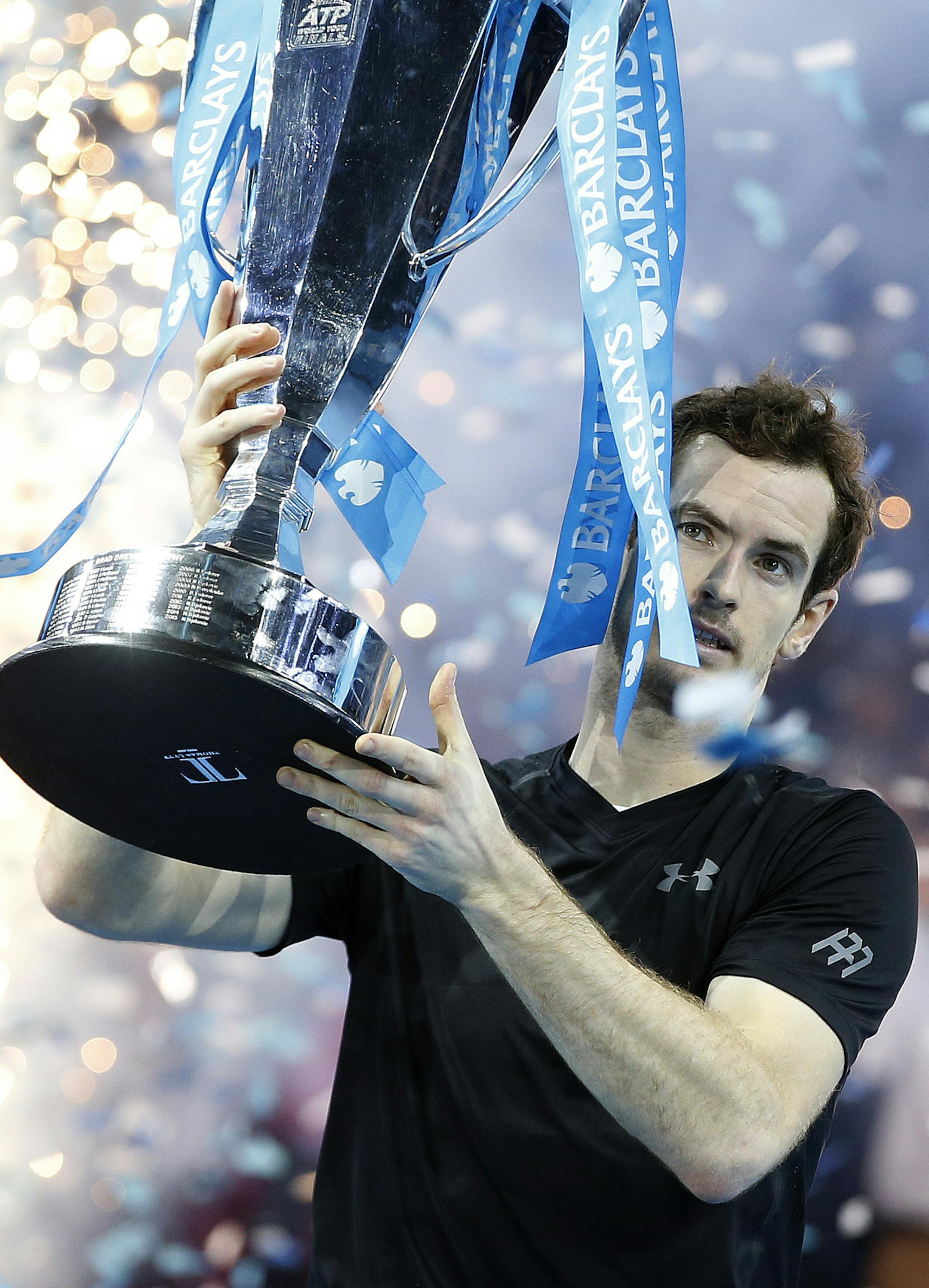 Andy Murray of Britain holds the trophy after winning the ATP World Tour Finals singles final tennis match against Novak Djokovic of Serbia at the O2 Arena in London, Sunday, Nov. 20, 2016. (AP Photo/Alastair Grant)