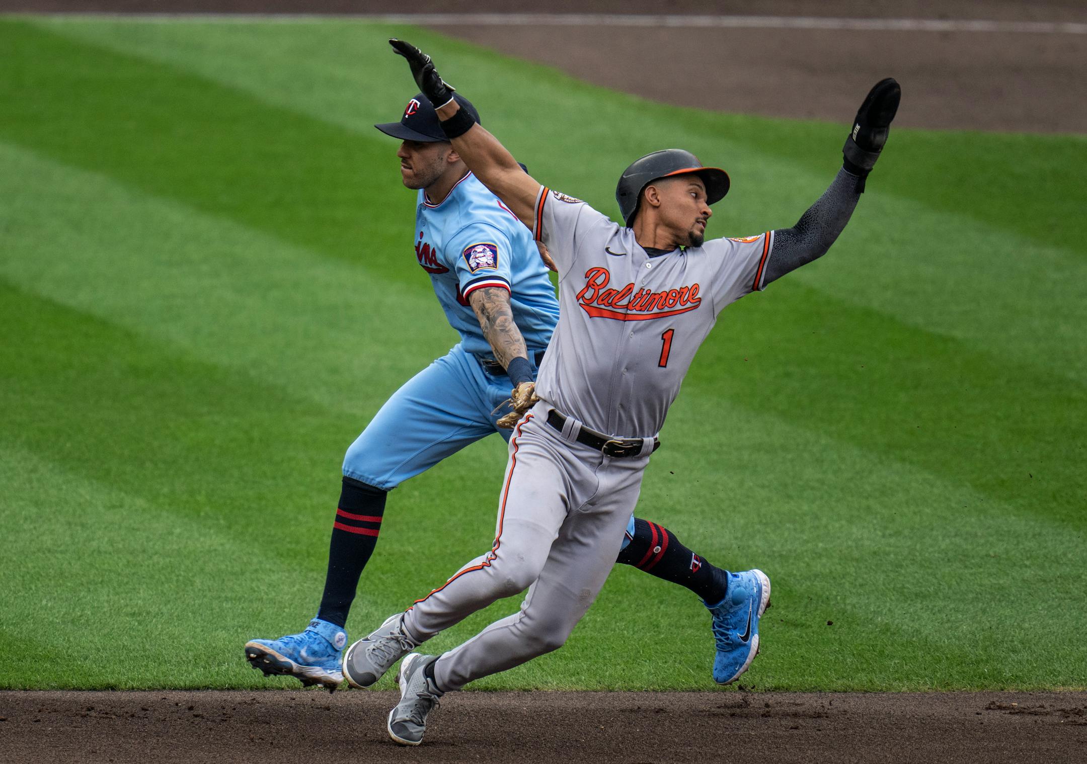 Baltimore Orioles second baseman Richie Martin (1) was tagged out by Minnesota Twins shortstop Carlos Correa (4) in the fifth inning.