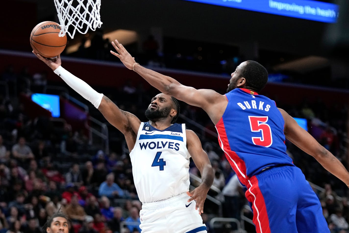 Minnesota Timberwolves guard Jaylen Nowell (4) drives on Detroit Pistons guard Alec Burks (5) in the second half of an NBA basketball game in Detroit, Wednesday, Jan. 11, 2023. (AP Photo/Paul Sancya)