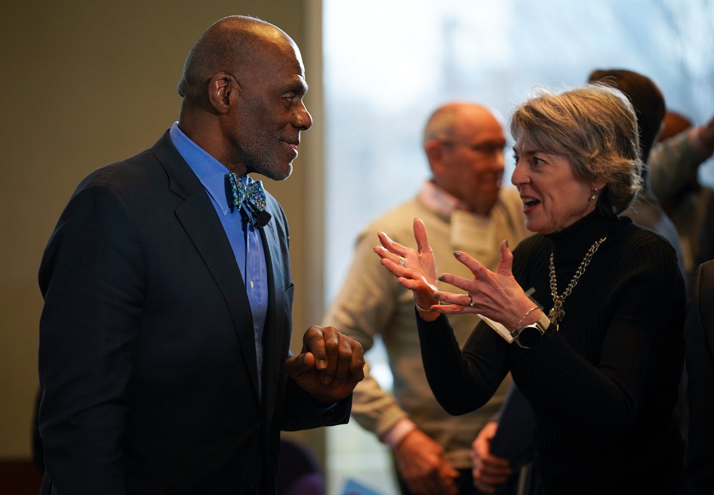 Former Supreme Court Justice Alan Page and Minneapolis Federal Reserve President Neel Kashkari hosted a community conversation in January to talk about the achievement gap and a proposed state constitutional amendment to guarantee a "quality education" for all children. Here, Page visited with Sue Riesgraf of the Banyan Community between panel discussions.