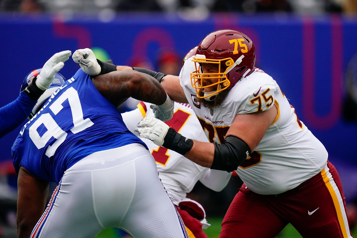 Washington Football Team guard Brandon Scherff (75) blocks New York Giants defensive tackle Dexter Lawrence (97) during the second quarter of an NFL football game, Sunday, Jan. 9, 2022, in East Rutherford, N.J. (AP Photo/Frank Franklin II)