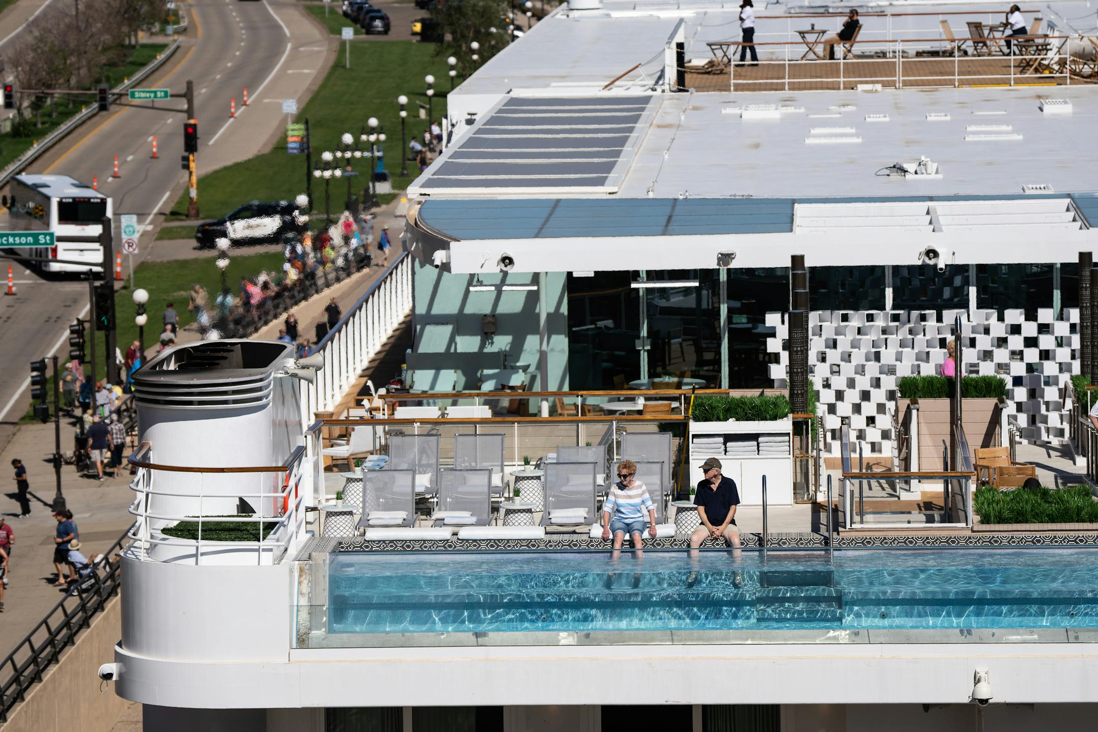 Passengers dip their feet into the upper deck infinity pool as the Viking Mississippi, a new Mississippi River cruise, parked on Saturday, Sept. 3, 2022 in downtown St. Paul, Minn. to pick up passengers for it's debut eight-day trip from St. Paul to St. Louis. The 386-passenger ship will return in mid-September for a 15-day cruise to New Orleans. ] RENEE JONES SCHNEIDER • renee.jones@startribune.com