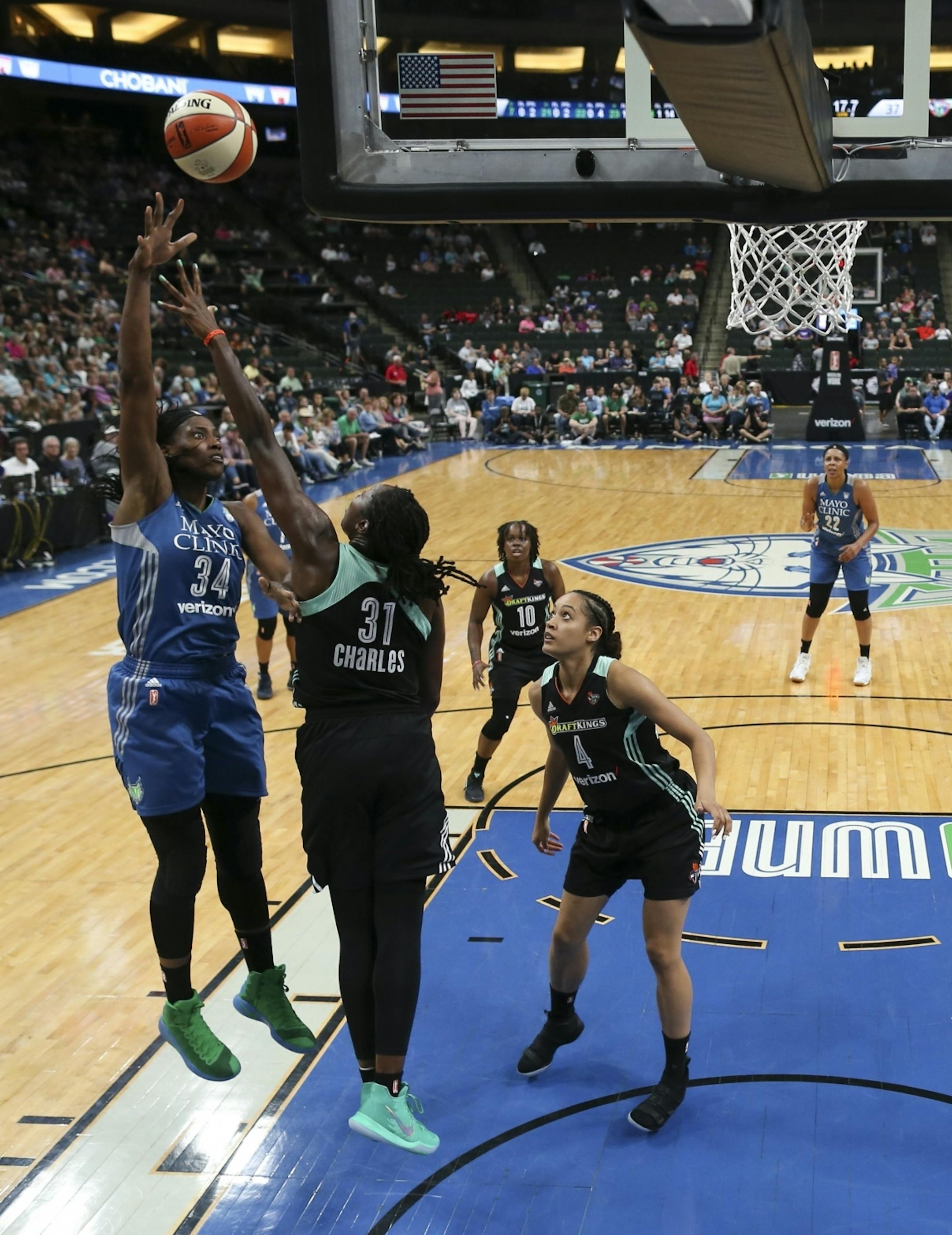 Minnesota Lynx center Sylvia Fowles (34) shot over New York Liberty center Tina Charles (31) in the first half.