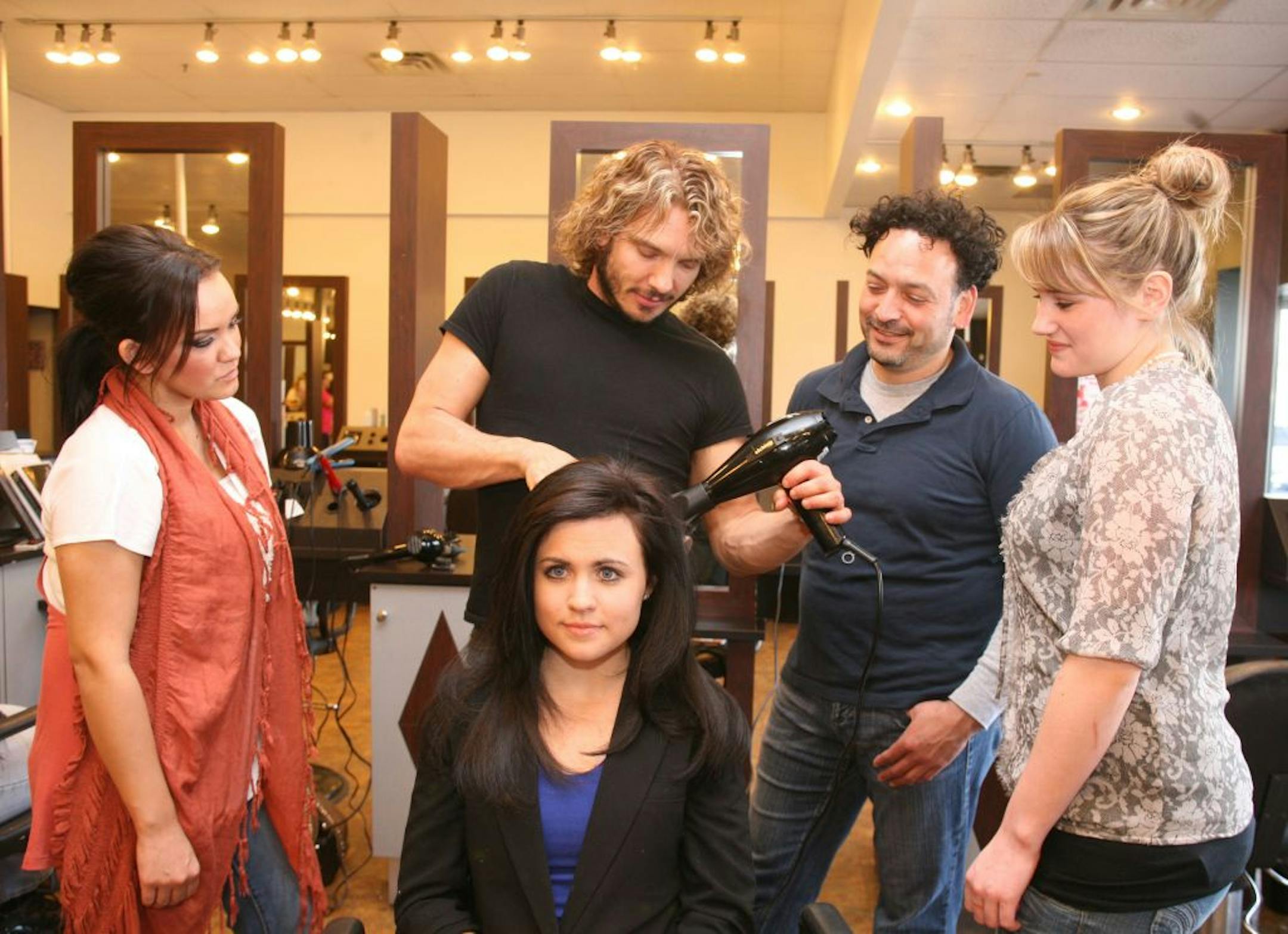 Photo courtesy of Kristi Matthews
Jason Deavalon teaching his signature blowout technique to employees of the soon-to-open The Wow Bar in Edina (thewowbar.com).