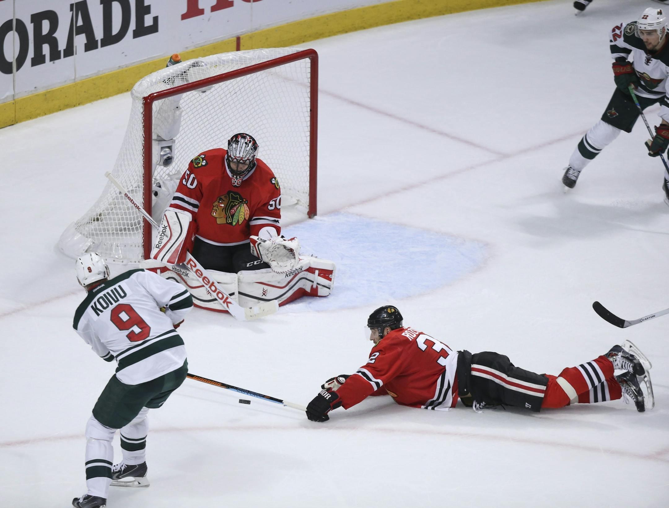 Blackhawks defenseman Michal Rozsival (32) dove to block a second period shot by Wild center Mikko Koivu (9) Friday night.