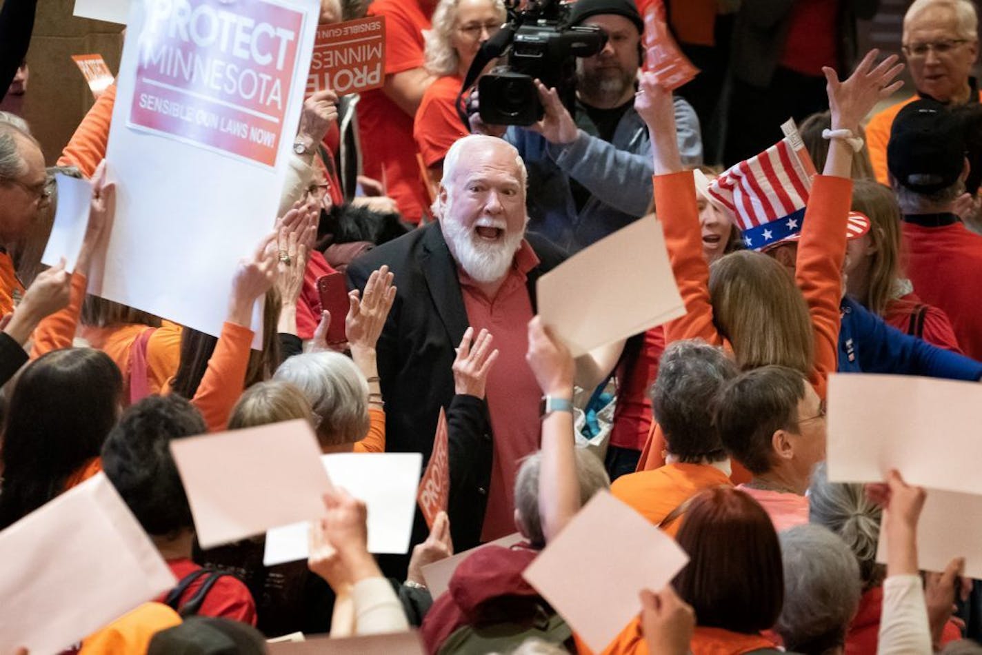 Gun safety advocates from Protect Minnesota and Moms Demand Action chanted and cheered on DFL legislators including Rep. Jack Considine Jr., DFL-Mankato, who plan to vote for bills today that would expand background checks and a new red flag law.