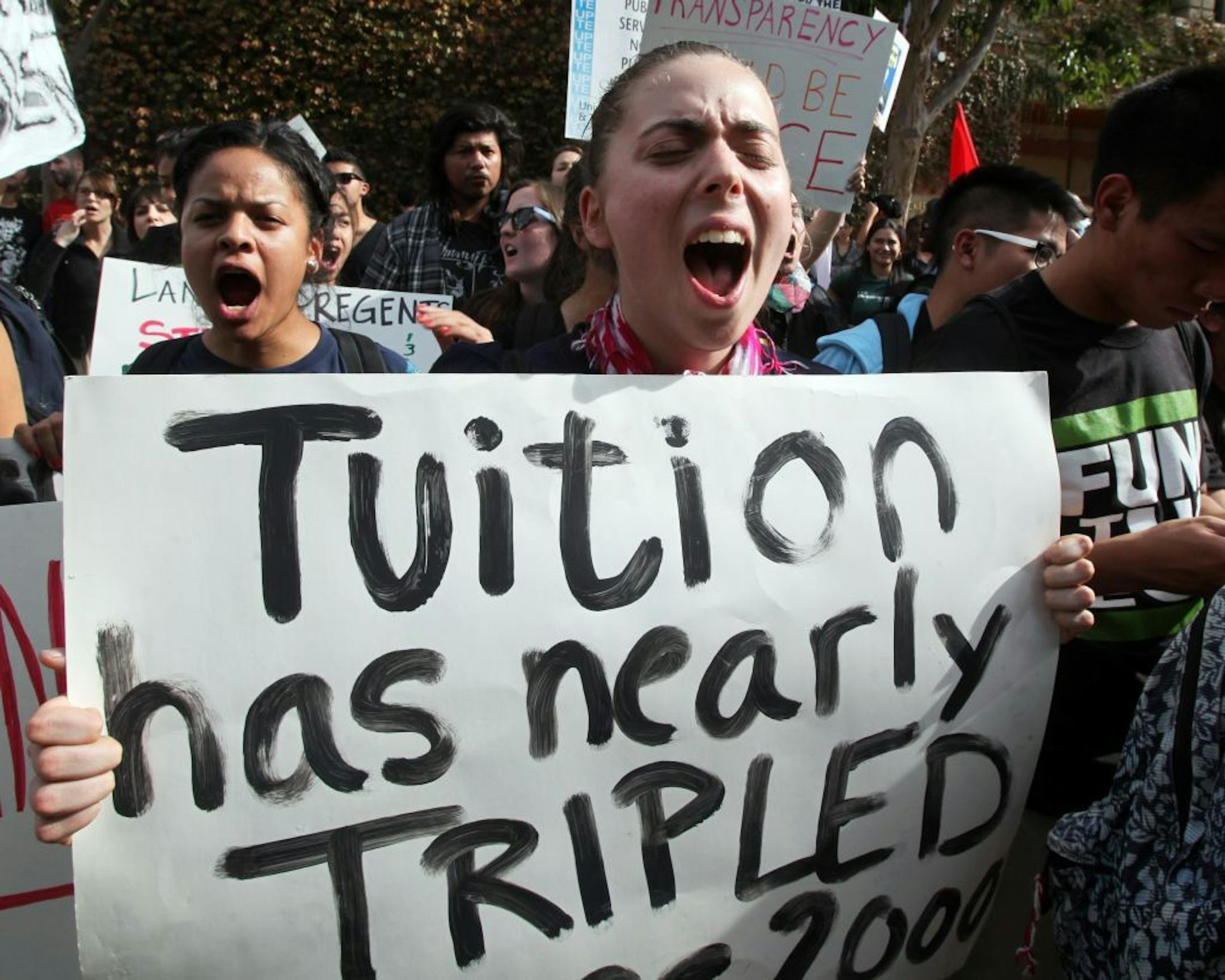 2011 photo of protesters shout outside a meeting of the Board of Regents regents of the University of California, on the UCLA campus in Los Angeles.