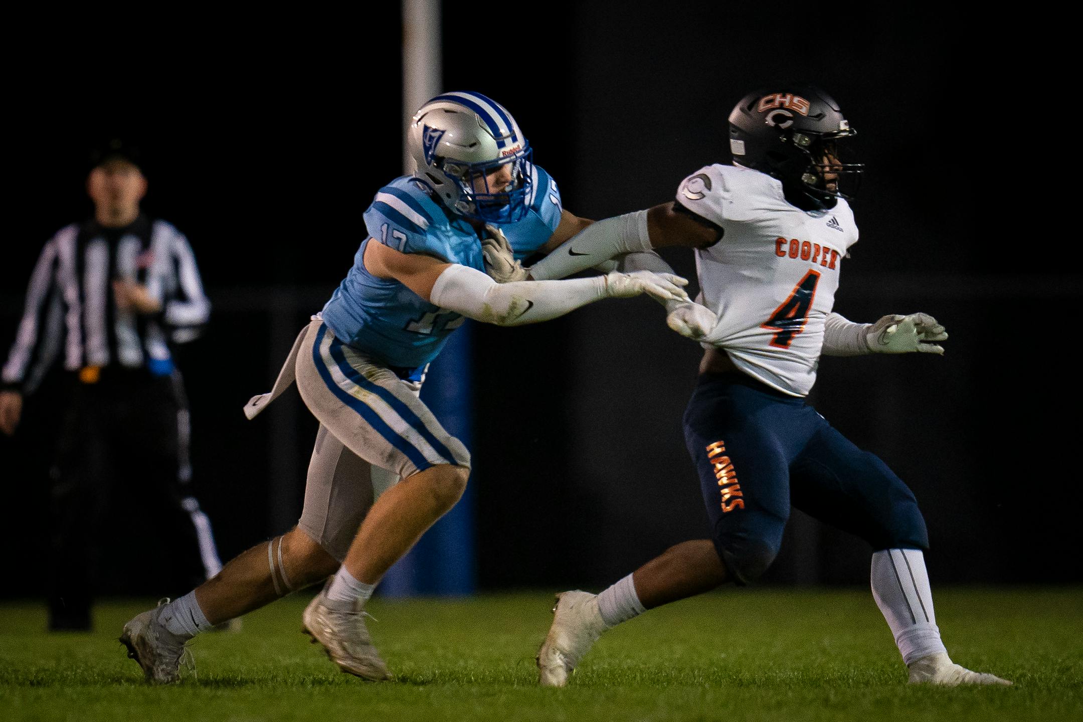 Bloomington Jefferson's Danny King (17) pursues Robbinsdale Cooper's Jaylen Hayes (4) Friday night.