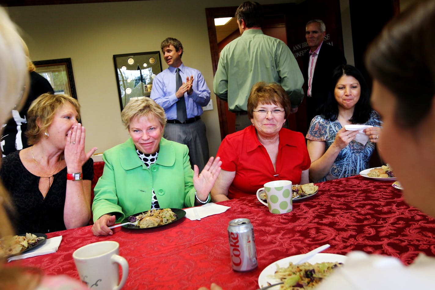 Left to right, Brenda Dombeck of Minnetonka Title, Cathy Robin of Advisors Mortgage, Marla Jean Alstead and Shelly Dressel enjoy the weekly all-office meal at Roger Fazendin Realtors in Wayzata Monday May 23, 2011.