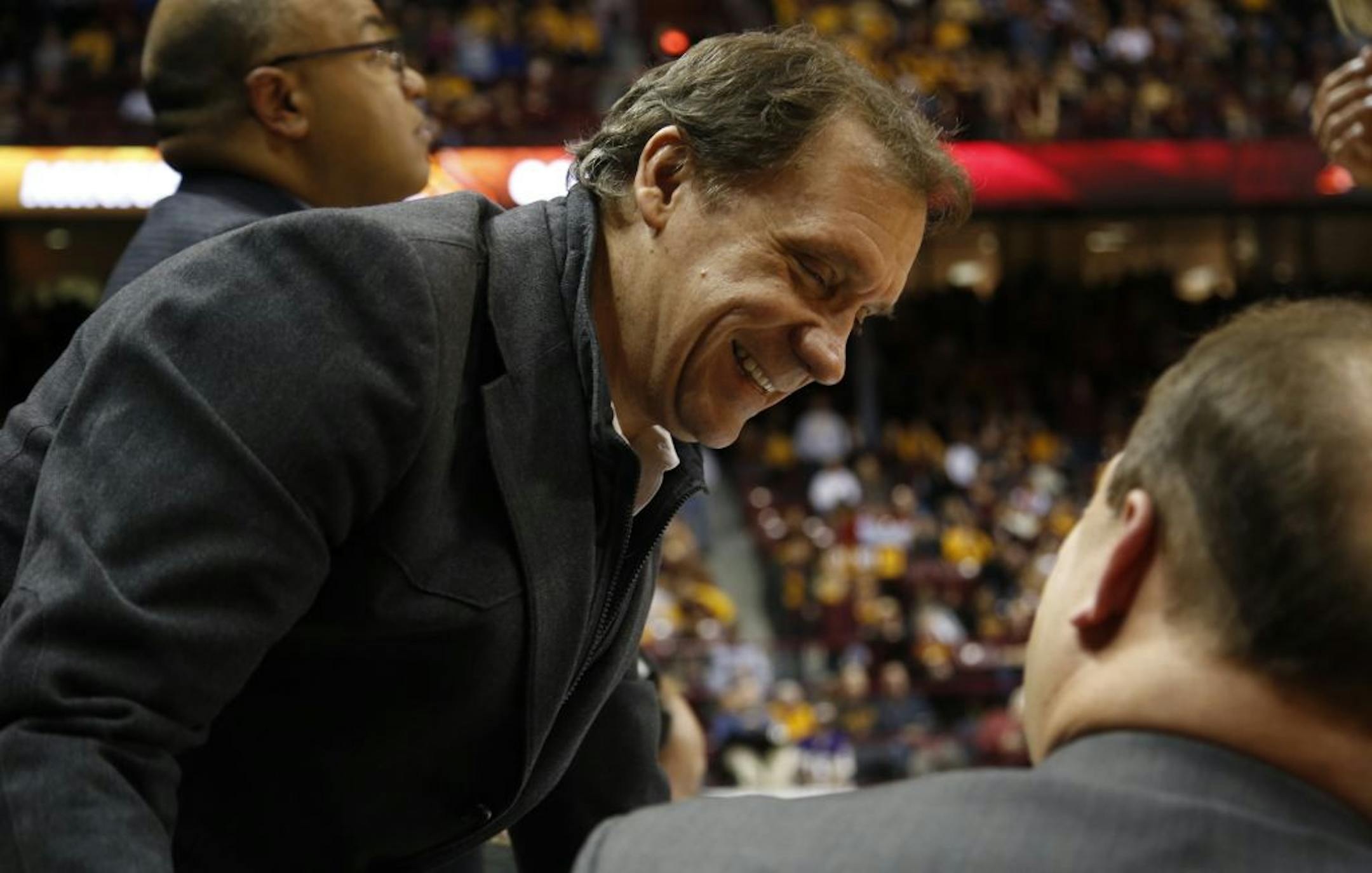 Former Timberwolves head coach Flip Saunders talked with ESPN commentator Dan Dakich during halftime of the Gophers game against Indiana.