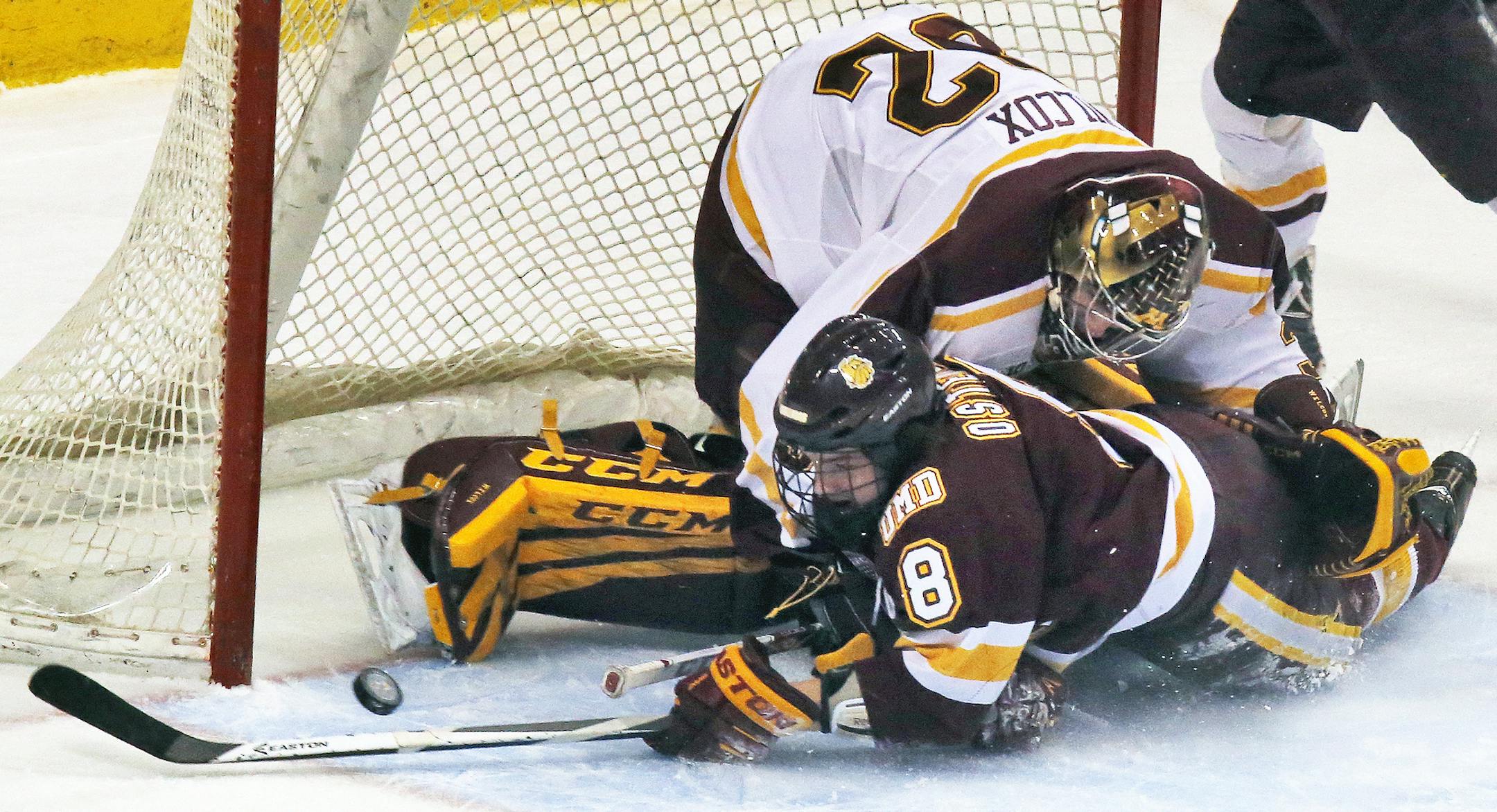 Minnesota Gophers vs. Minnesota Duluth Bulldogs. Bulldogs Kyle Osterberg trie to no avail to slip the puck past Gophers goalie Adam Wilcox in first period action. (MARLIN LEVISON/STARTRIBUNE(mlevison@startribune.com)